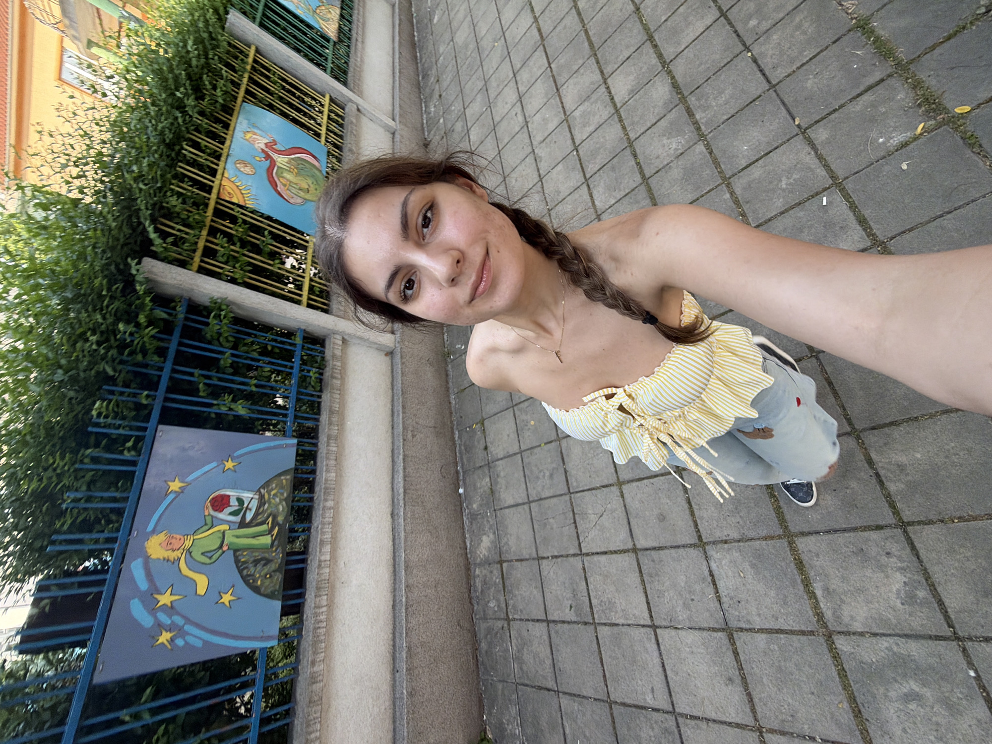 Woman takes selfies on street in Burgas, Bulgaria