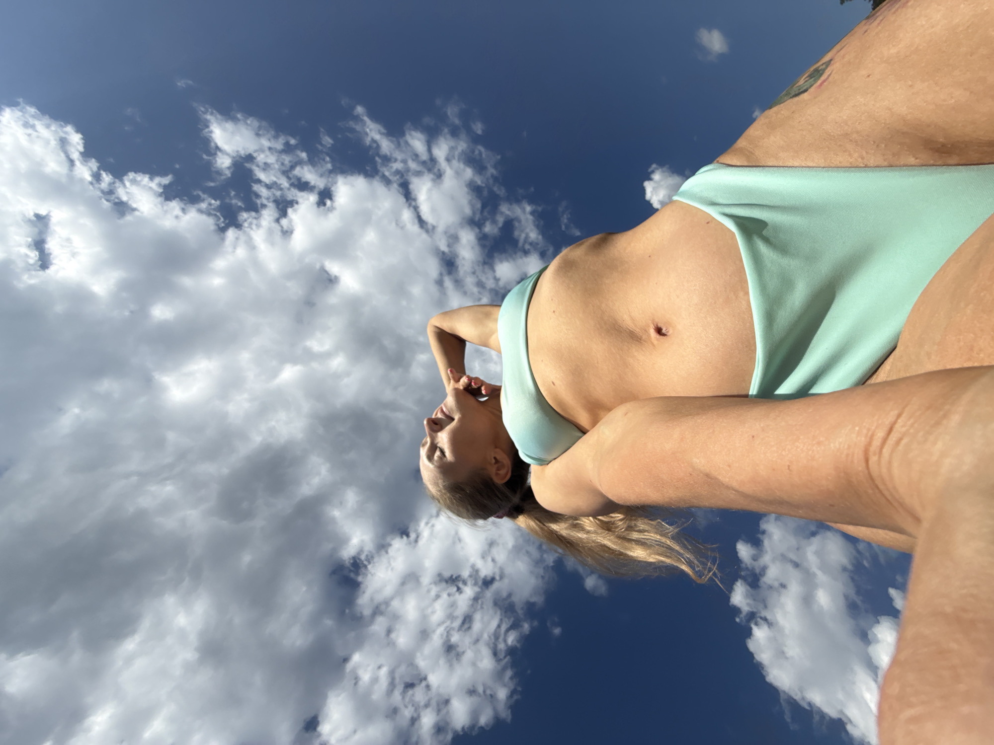 Woman photographed in bikini against sky in Chaikovsky, Russia