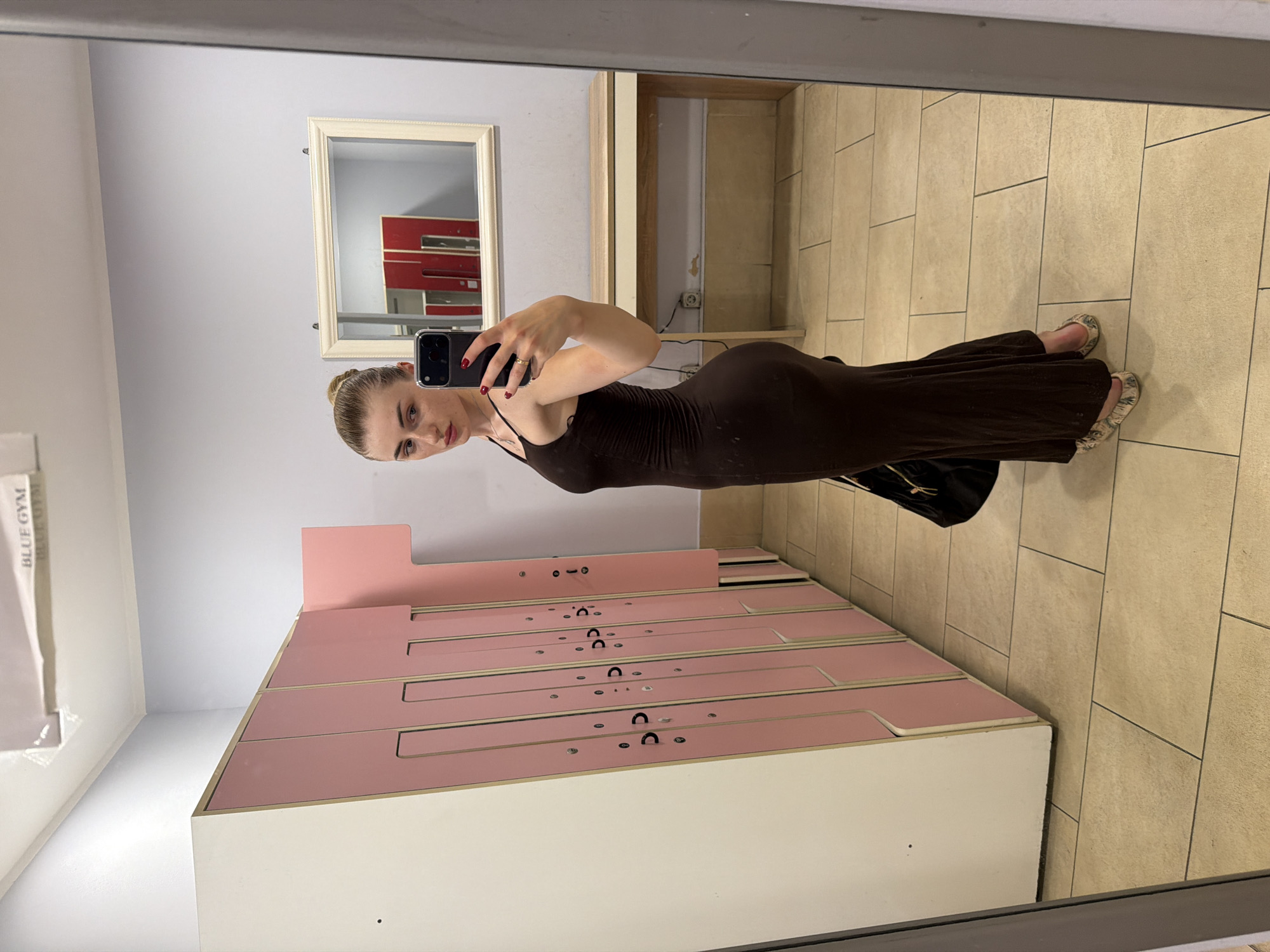 Locker room mirror selfie in a brown maxi dress