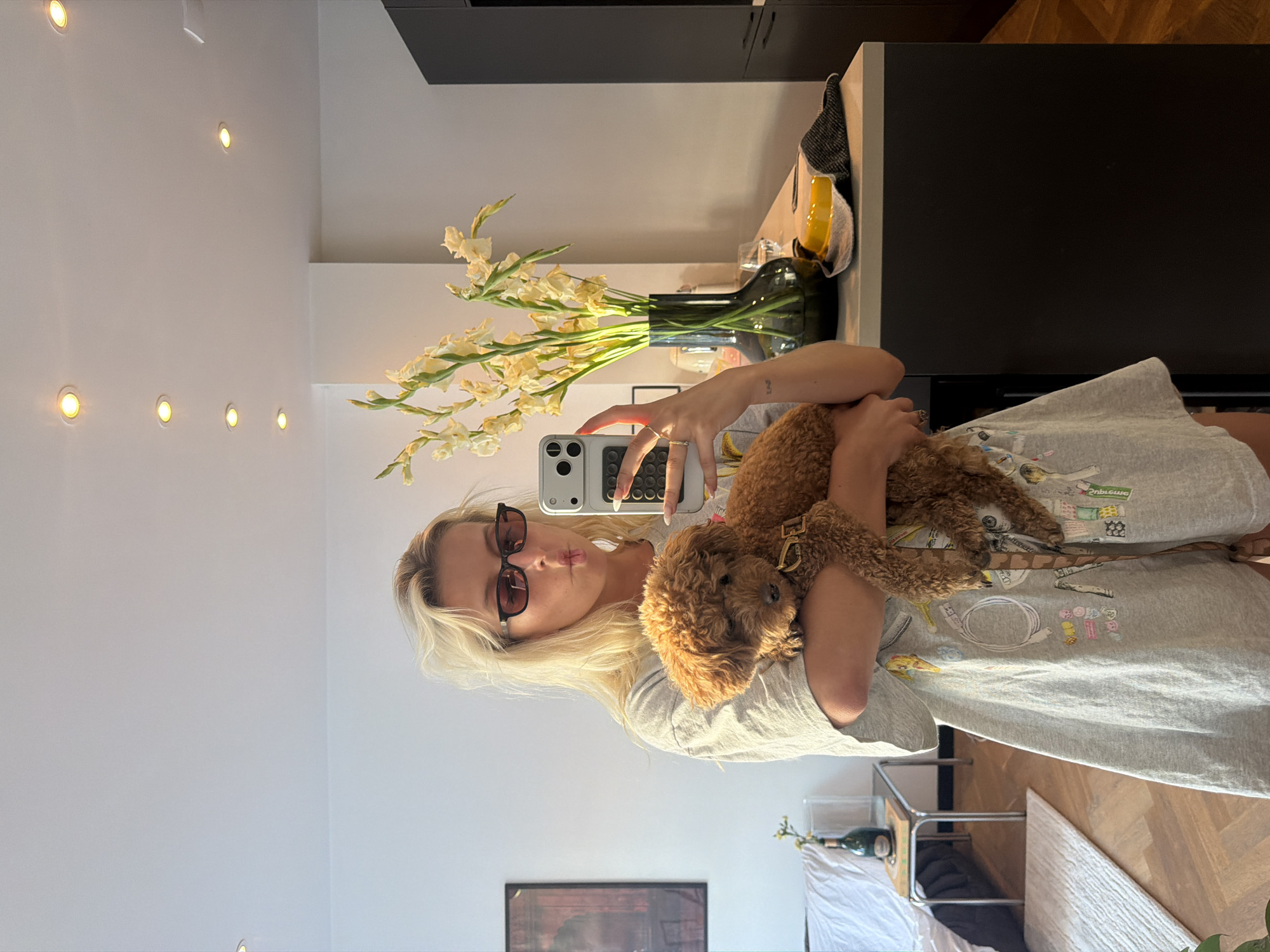 Mirror selfies with a poodle in an Amsterdam apartment