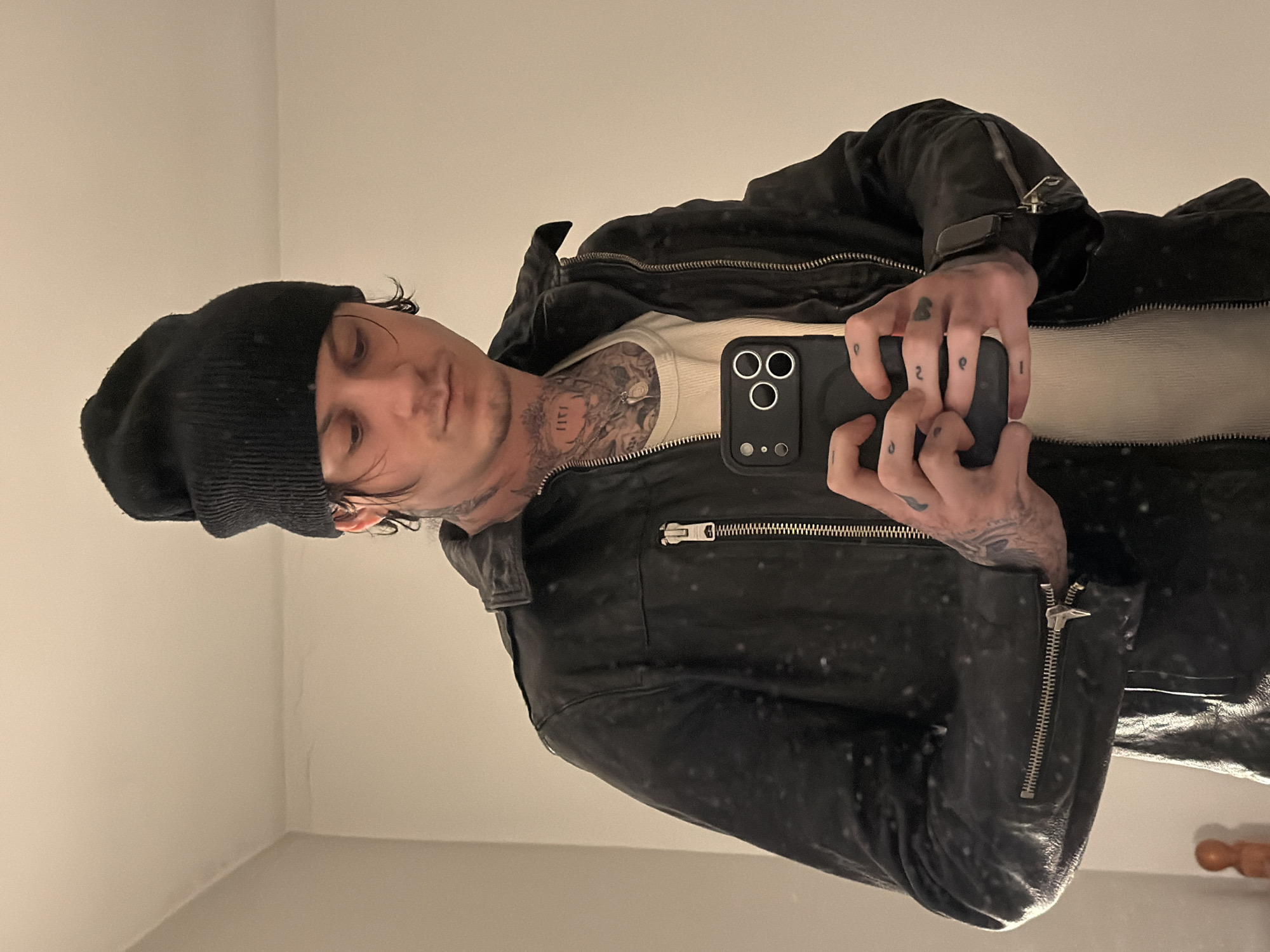 Man takes selfie in London wearing leather jacket