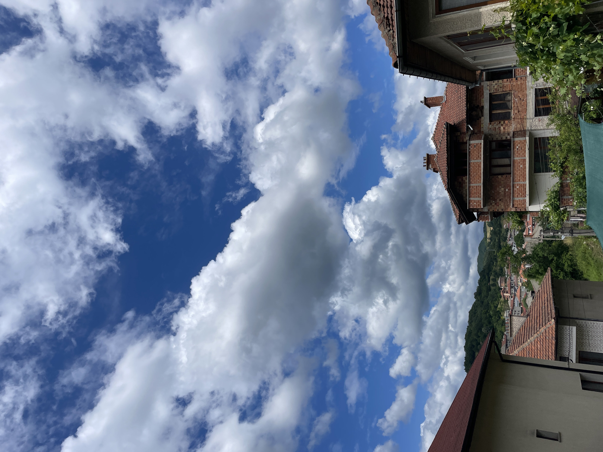 Morning views of Bulgarian mountain town documented under cloudy skies