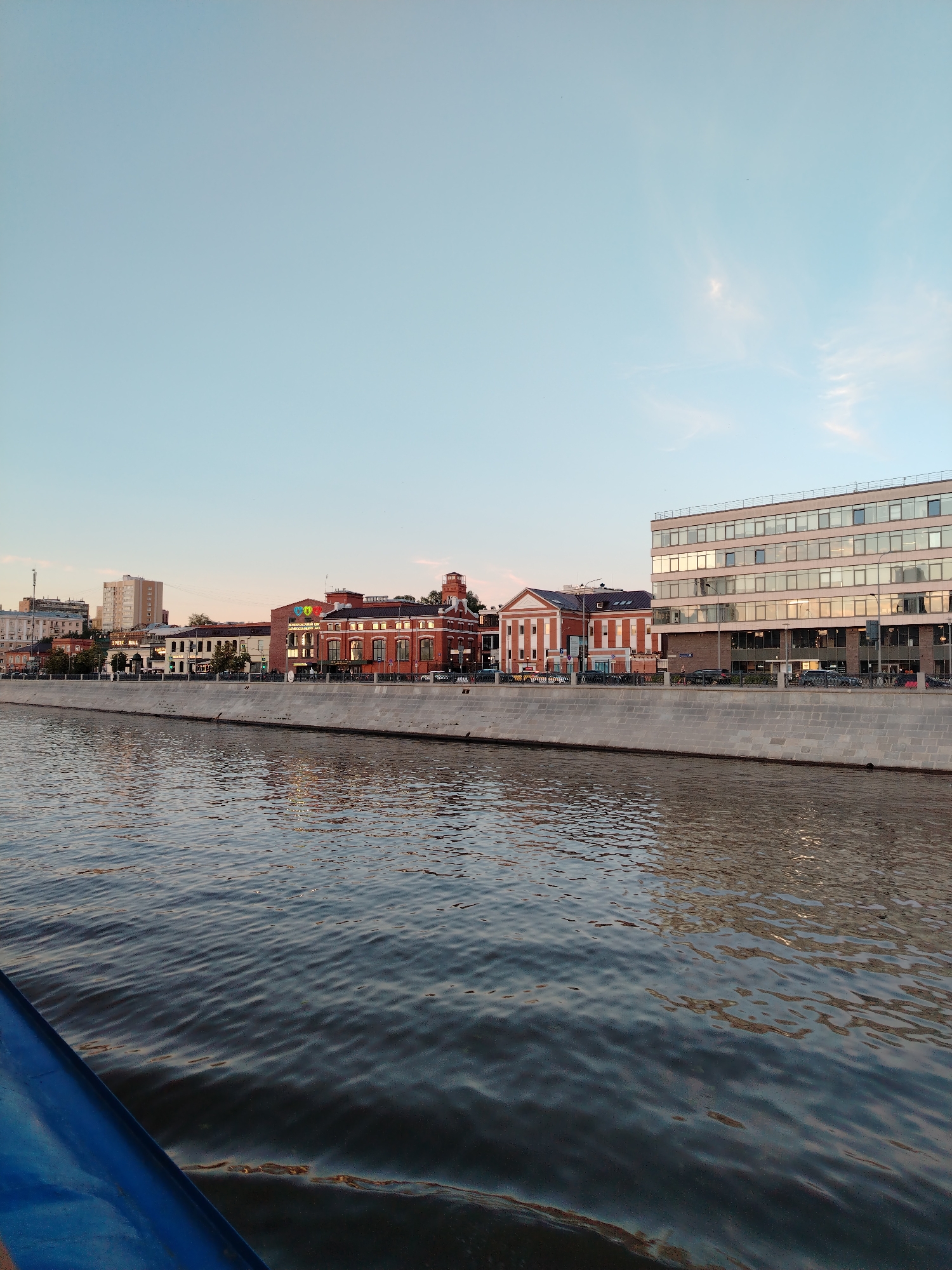 Evening boat ride along a Moscow river at dusk