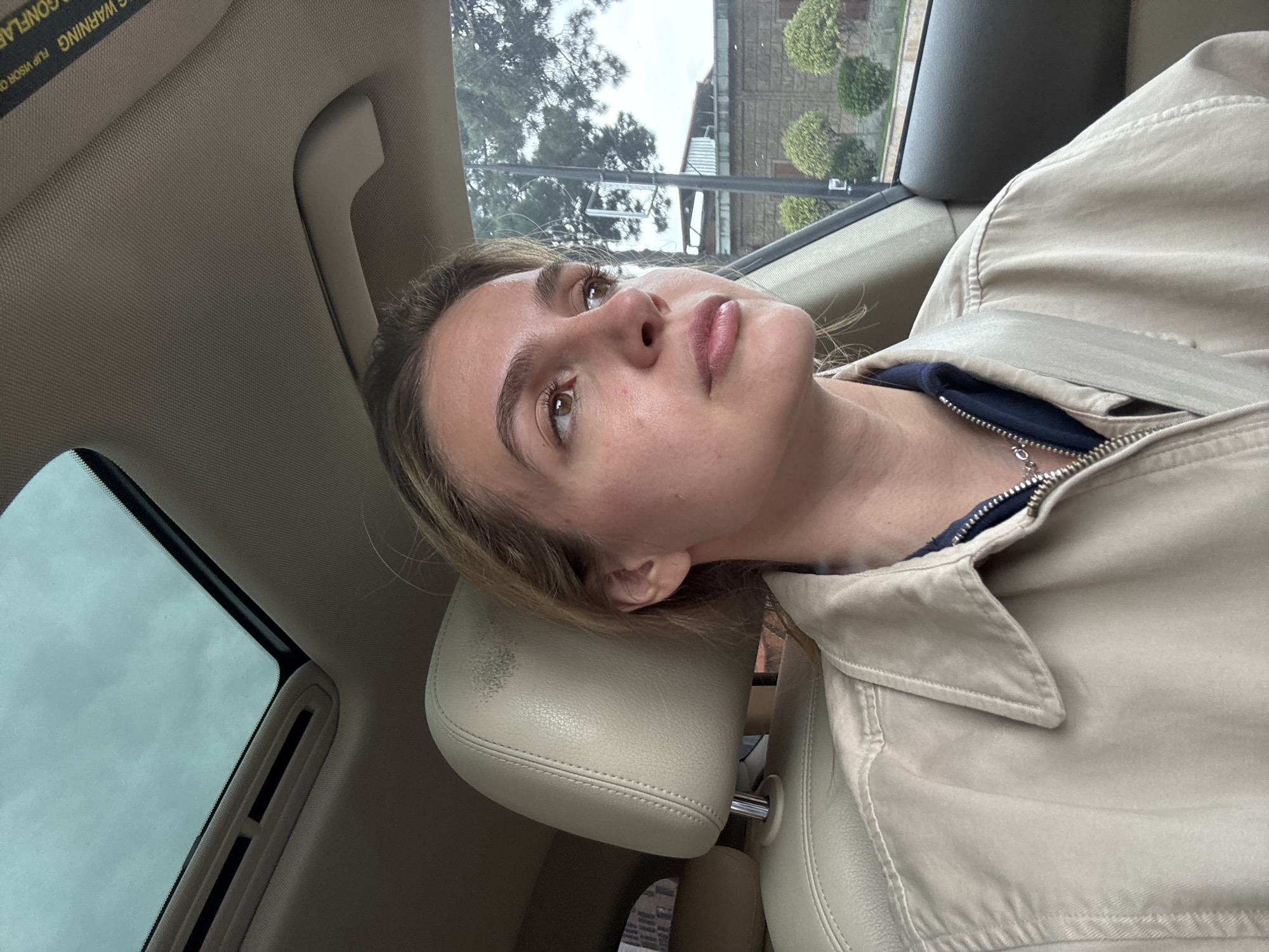 Woman resting in car captured in close-up moment