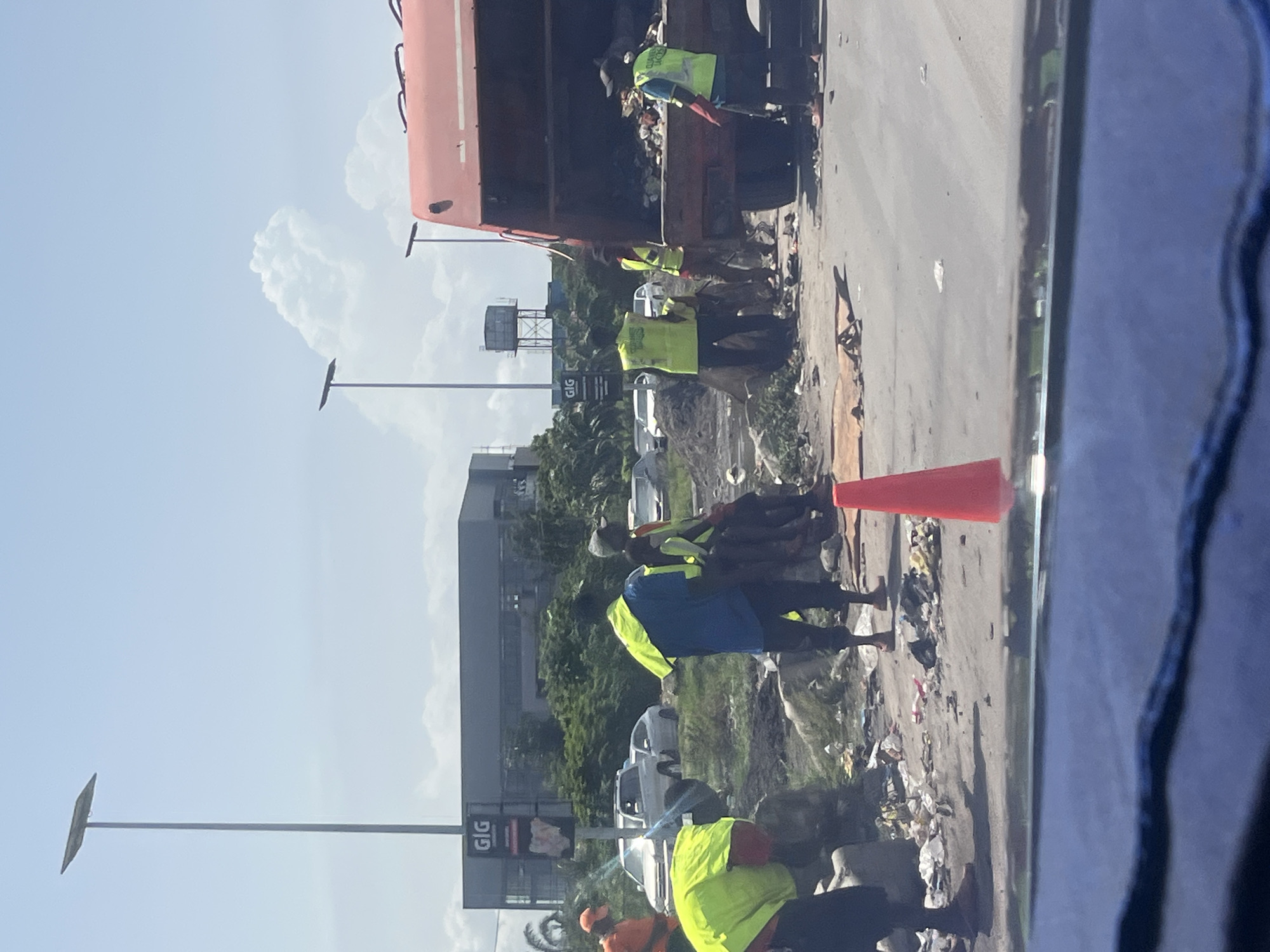Municipal workers conduct street cleaning operations in Lagos
