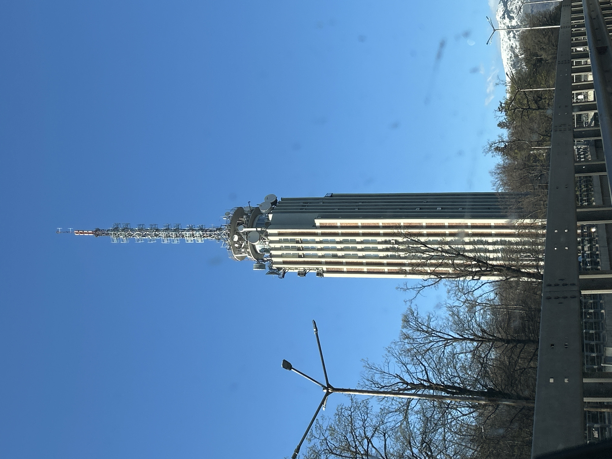 Urban tower and mountain landscape documented by witnesses