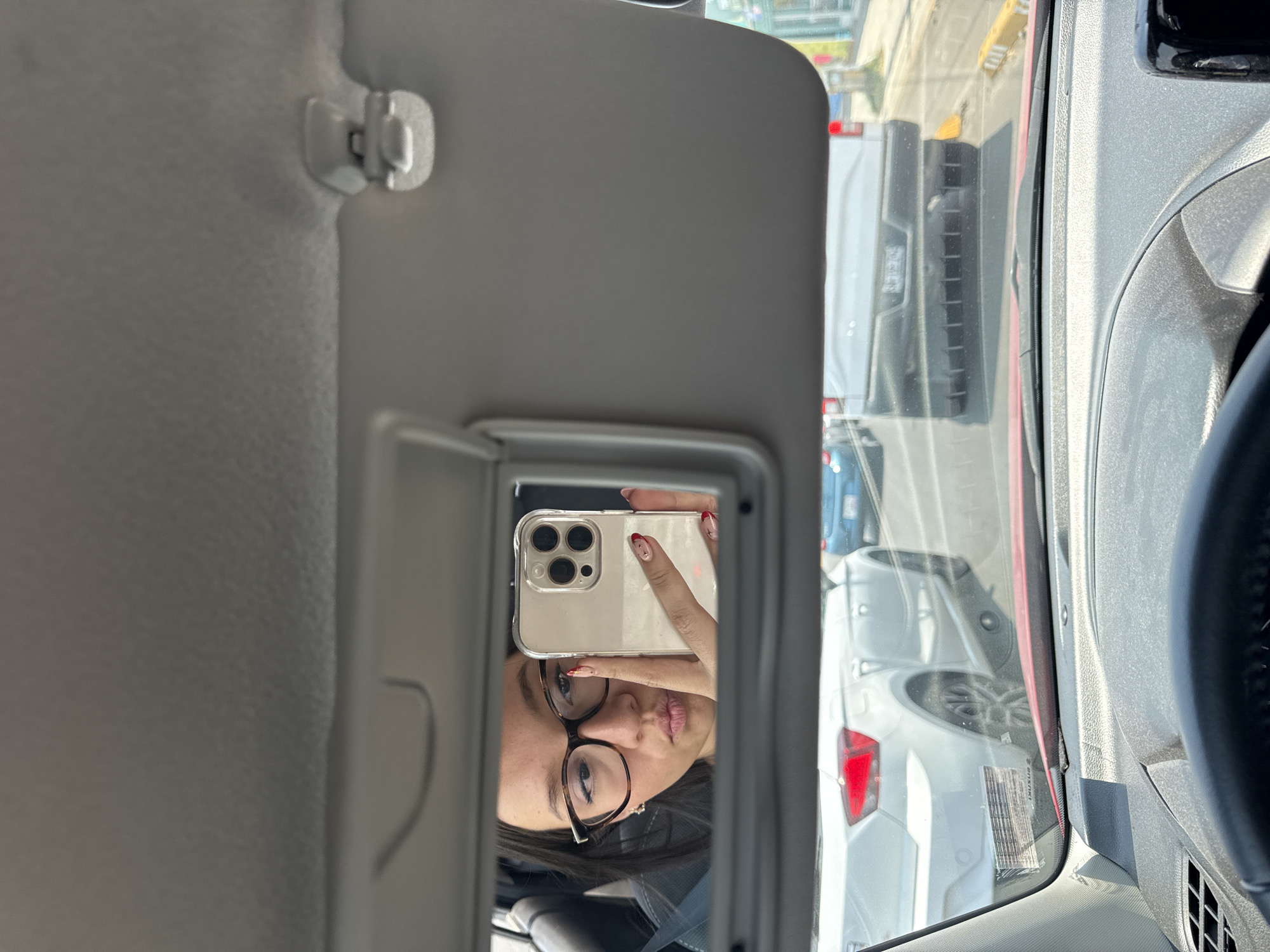 Woman takes selfie in car mirror in Mexico