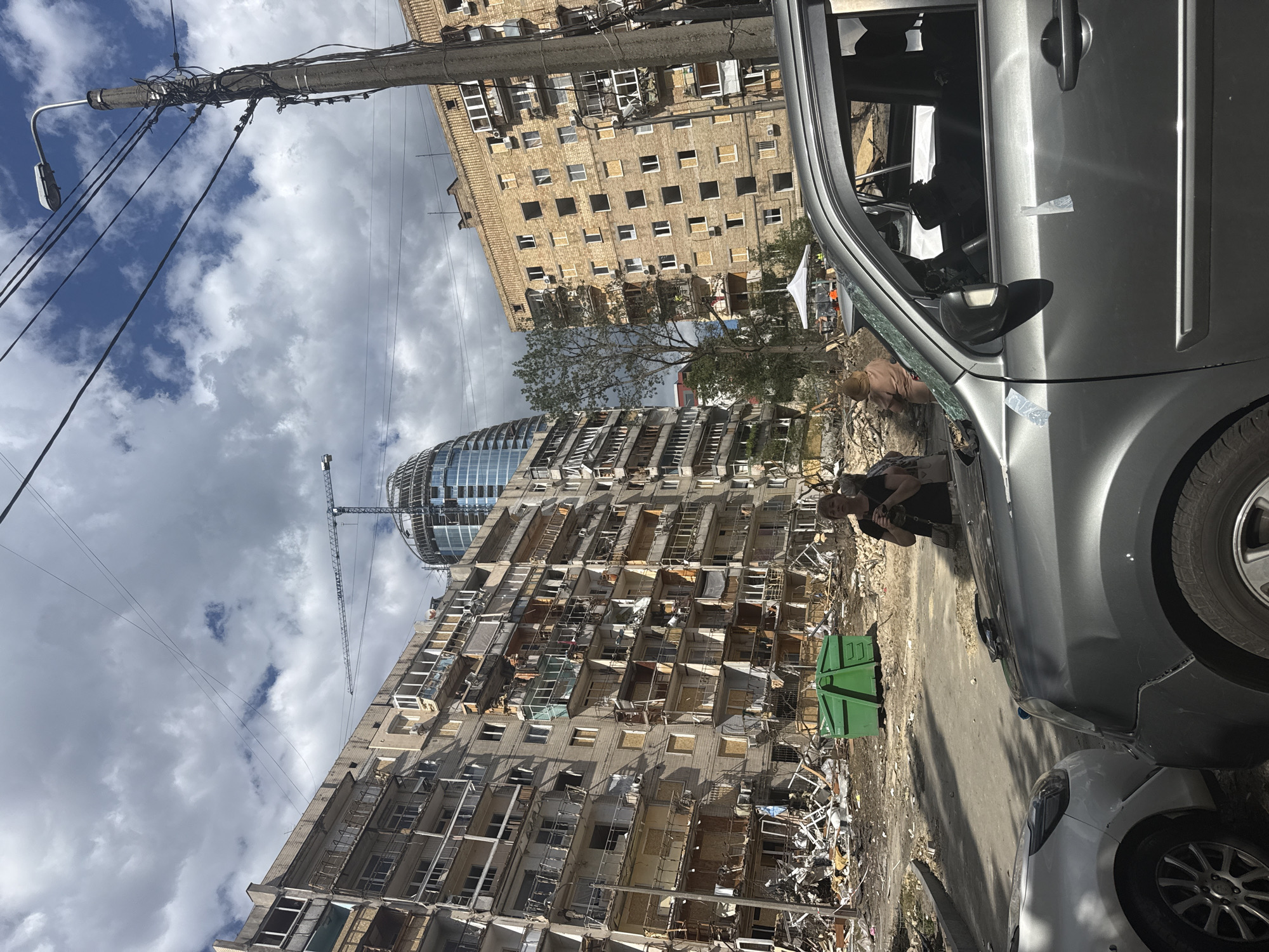 Kyiv residential buildings hit, debris and burnt cars fill the streets