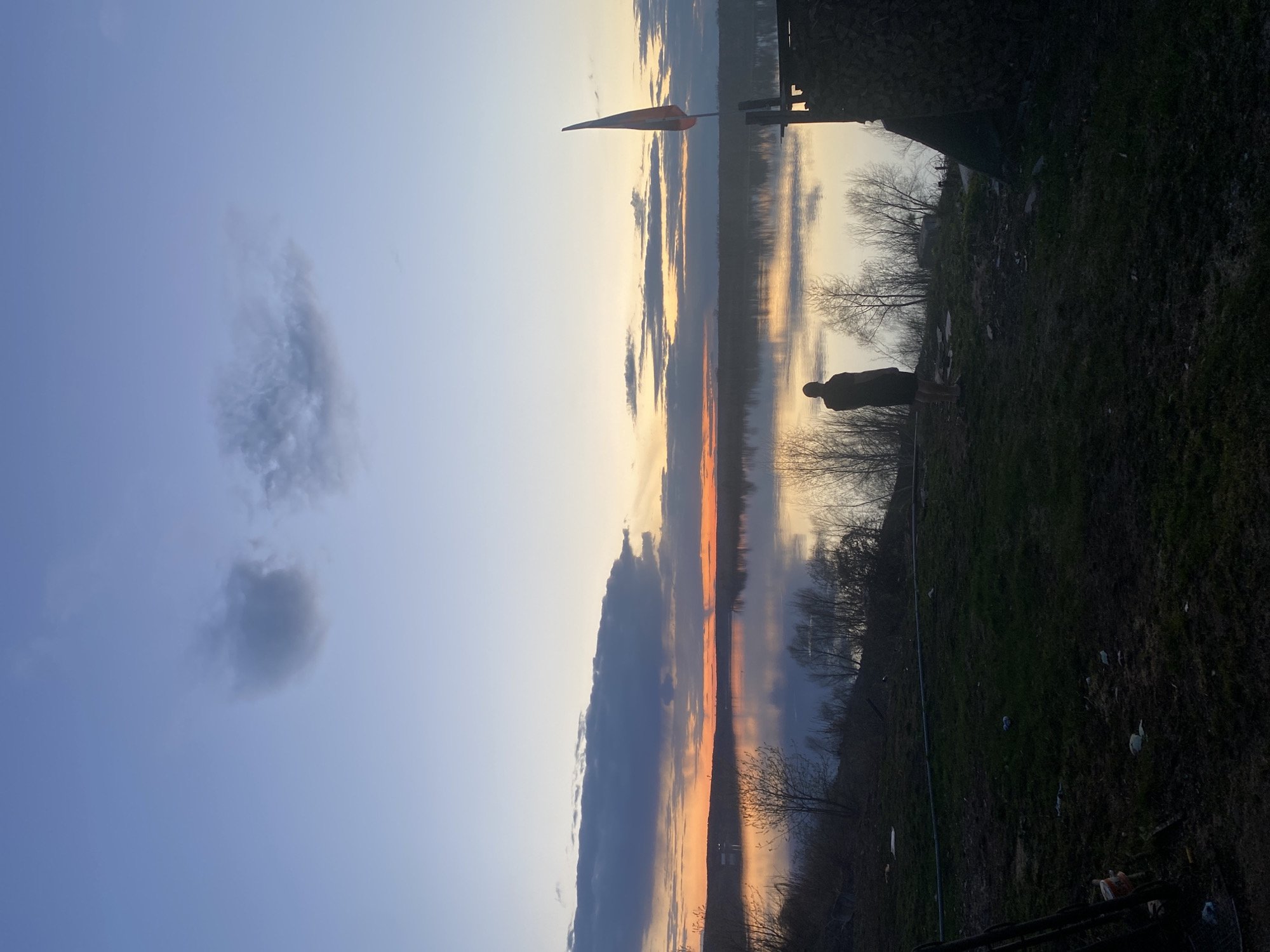 Sunset documented over water in Ольховка, Russia April 30