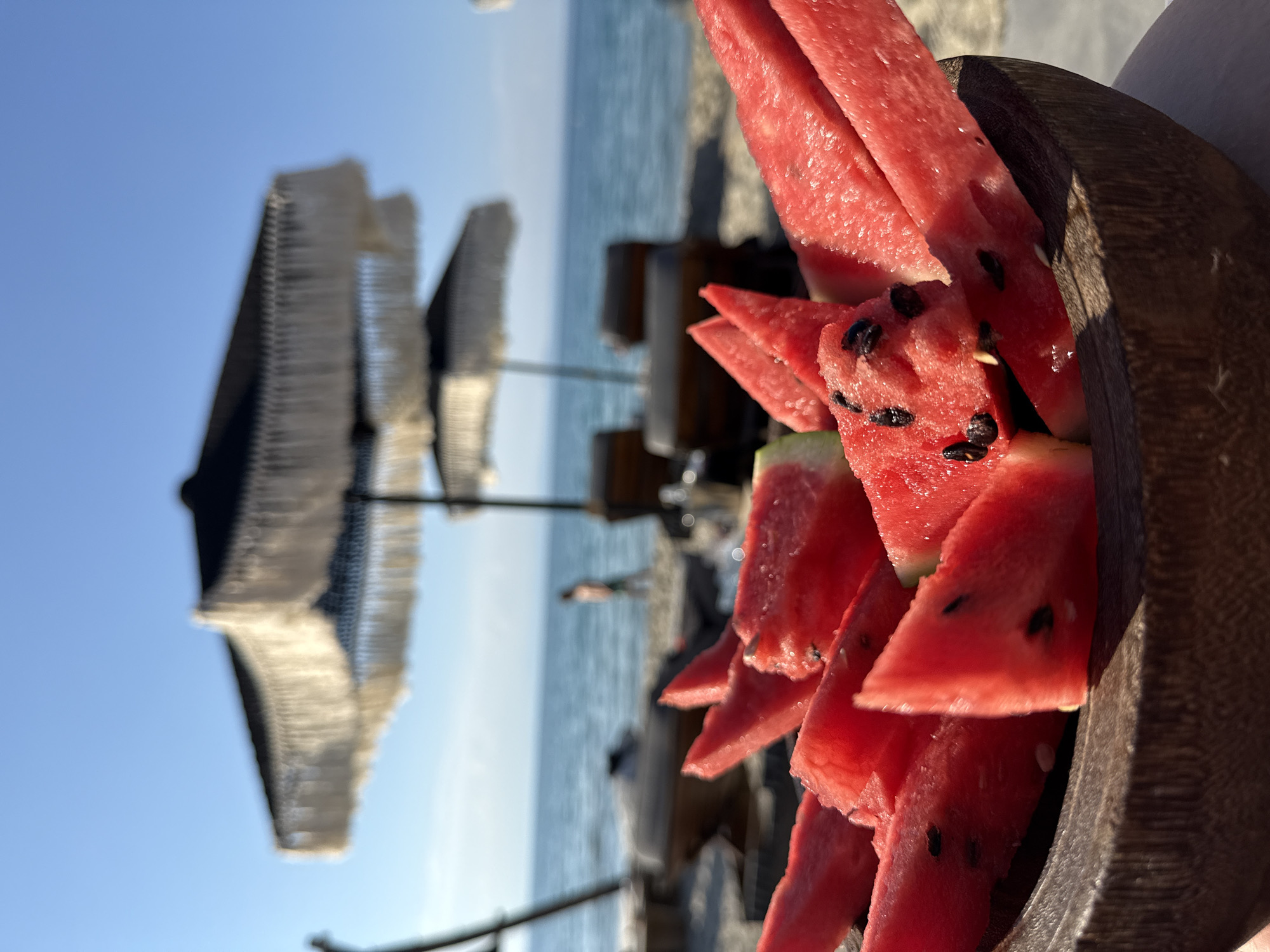Watermelon and fried food at a Greek beach spot