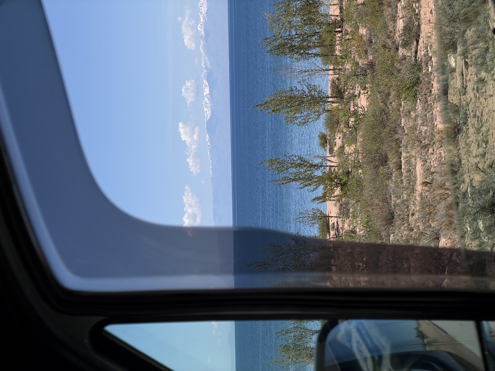 Vehicle passenger captures landscape view in Kaji-Say, Kyrgyzstan