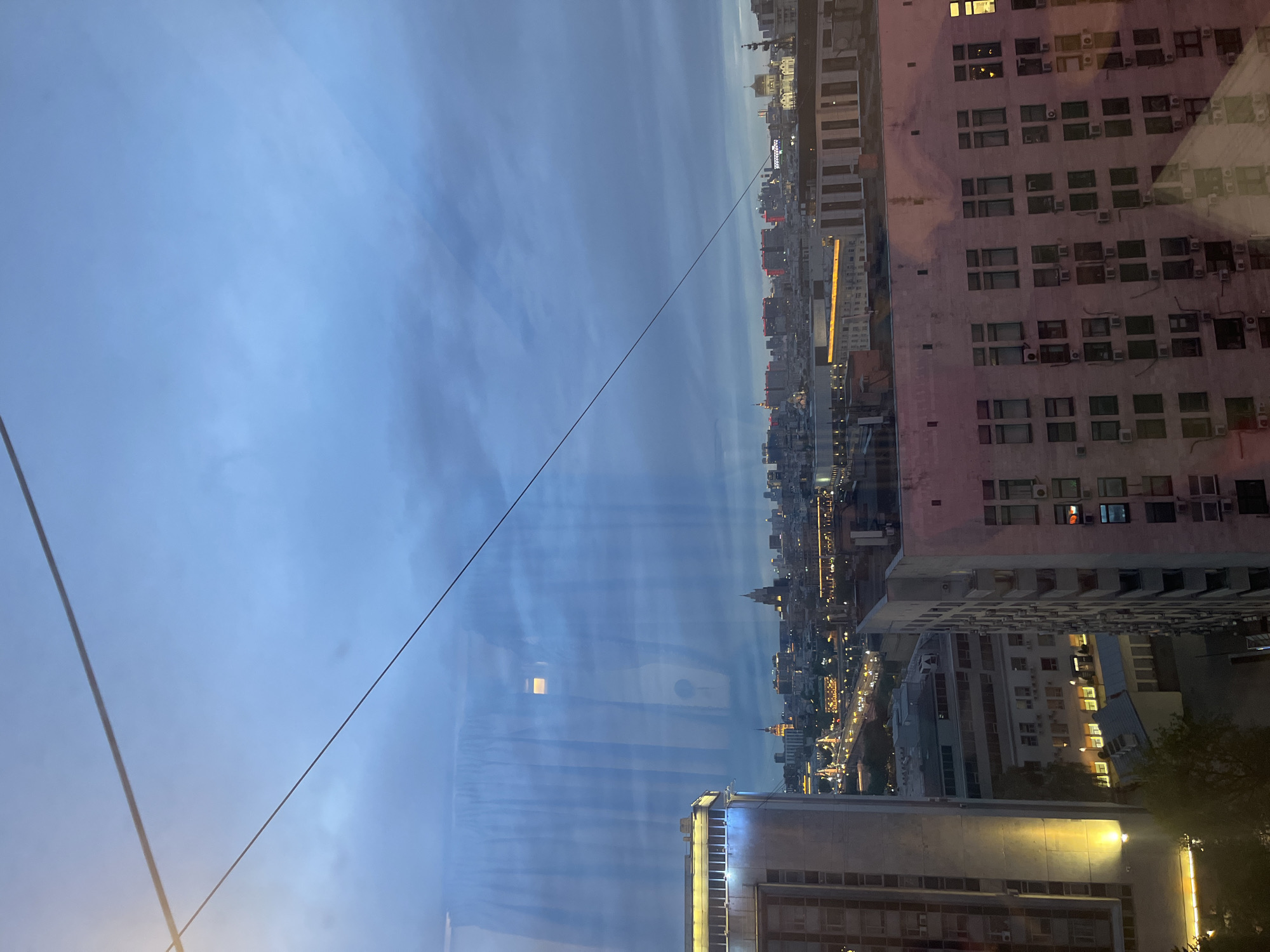 Moscow evening: cityscape view and woman on sofa
