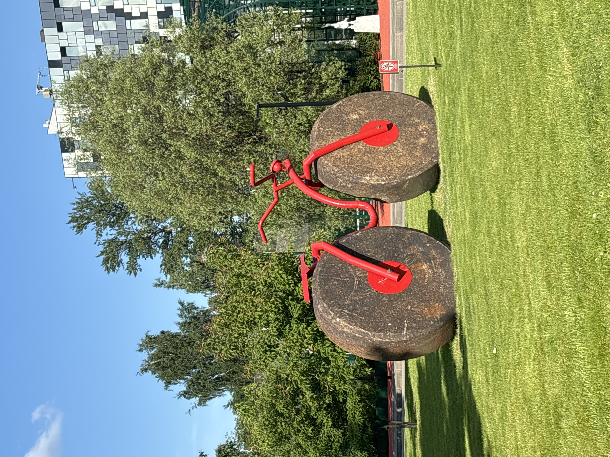 Modern park visit with red metal sculptures in Saint Petersburg