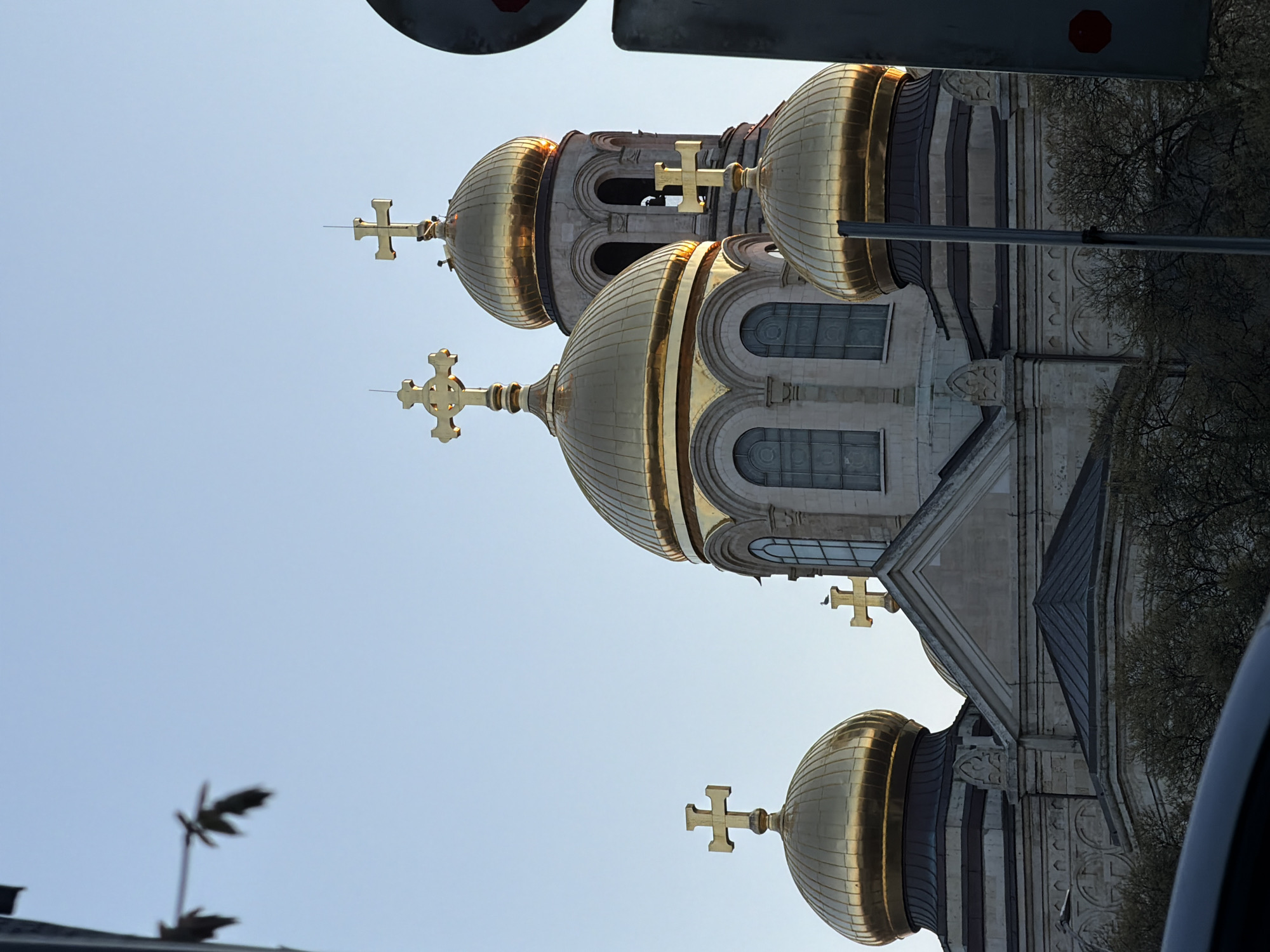 Golden-domed cathedral observed from Varna streets during afternoon