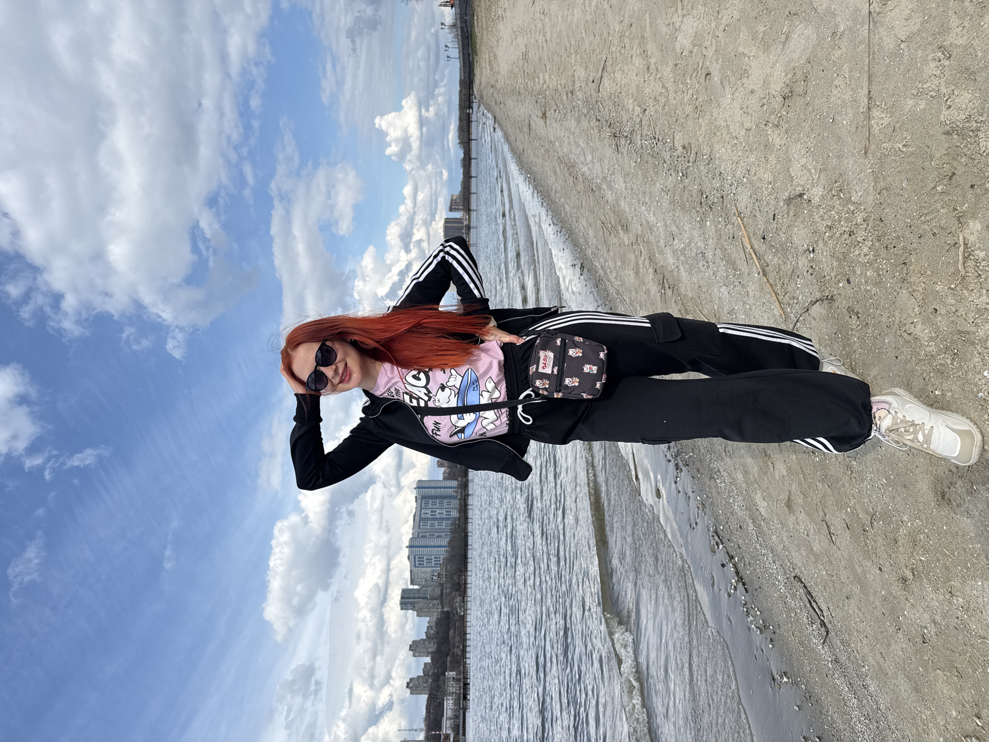 Woman poses for photos along Don River waterfront in Rostov-on-Don