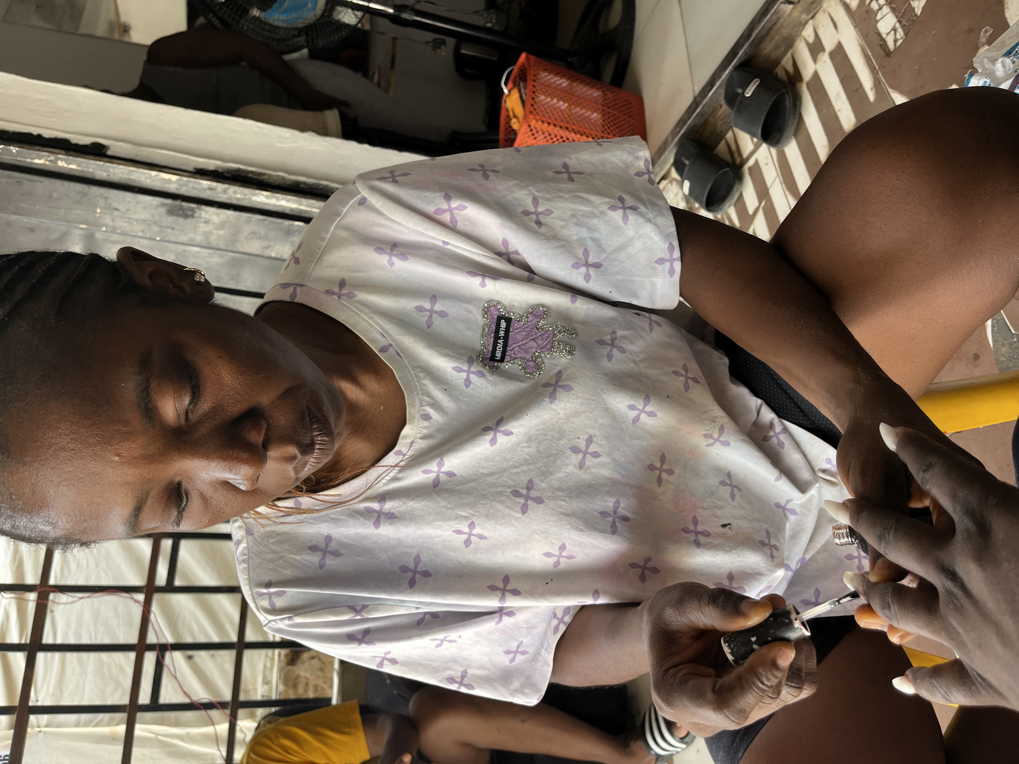 Morning street life and beauty services documented across Abuja