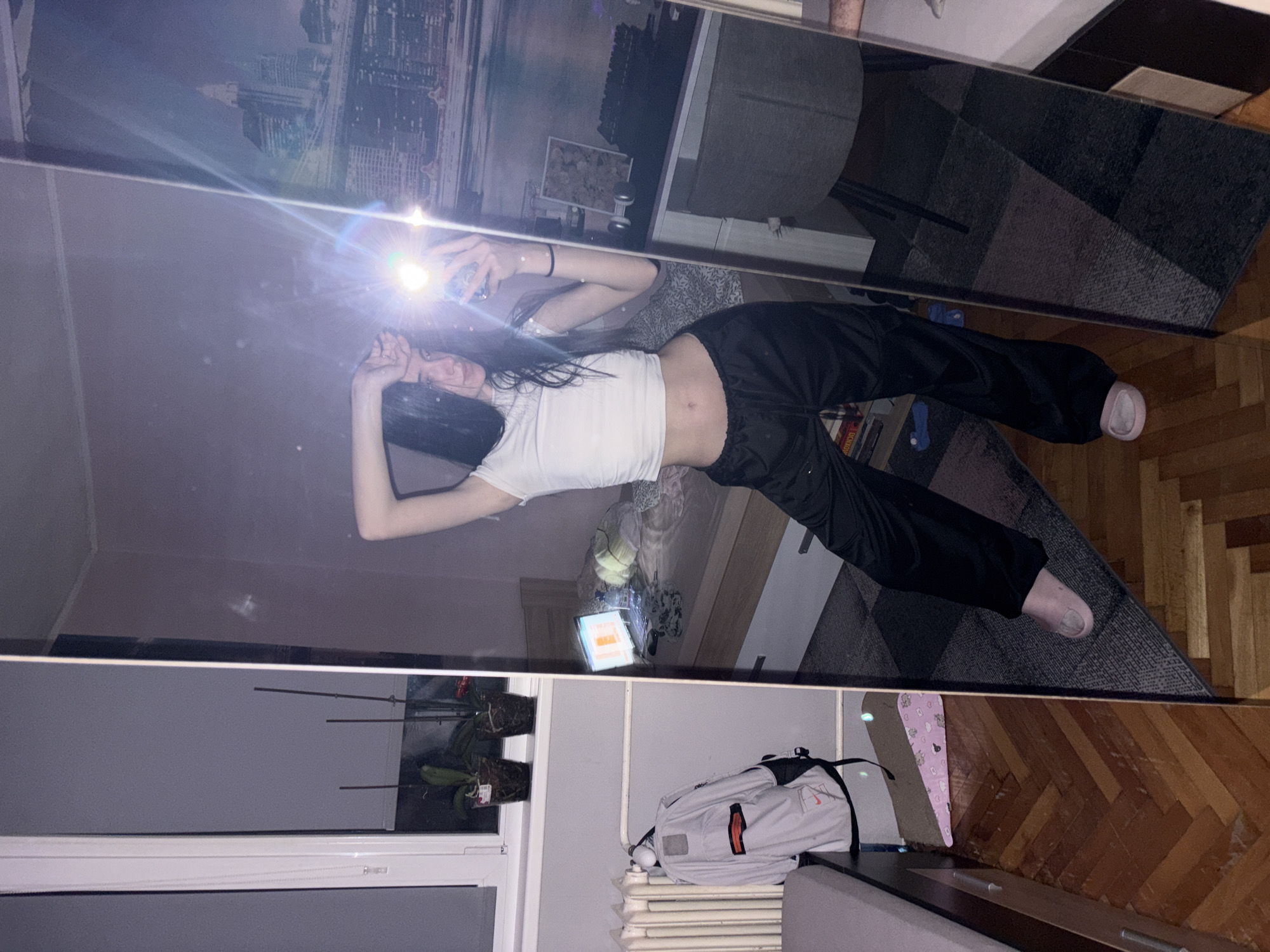Woman takes mirror selfie in Sofia apartment