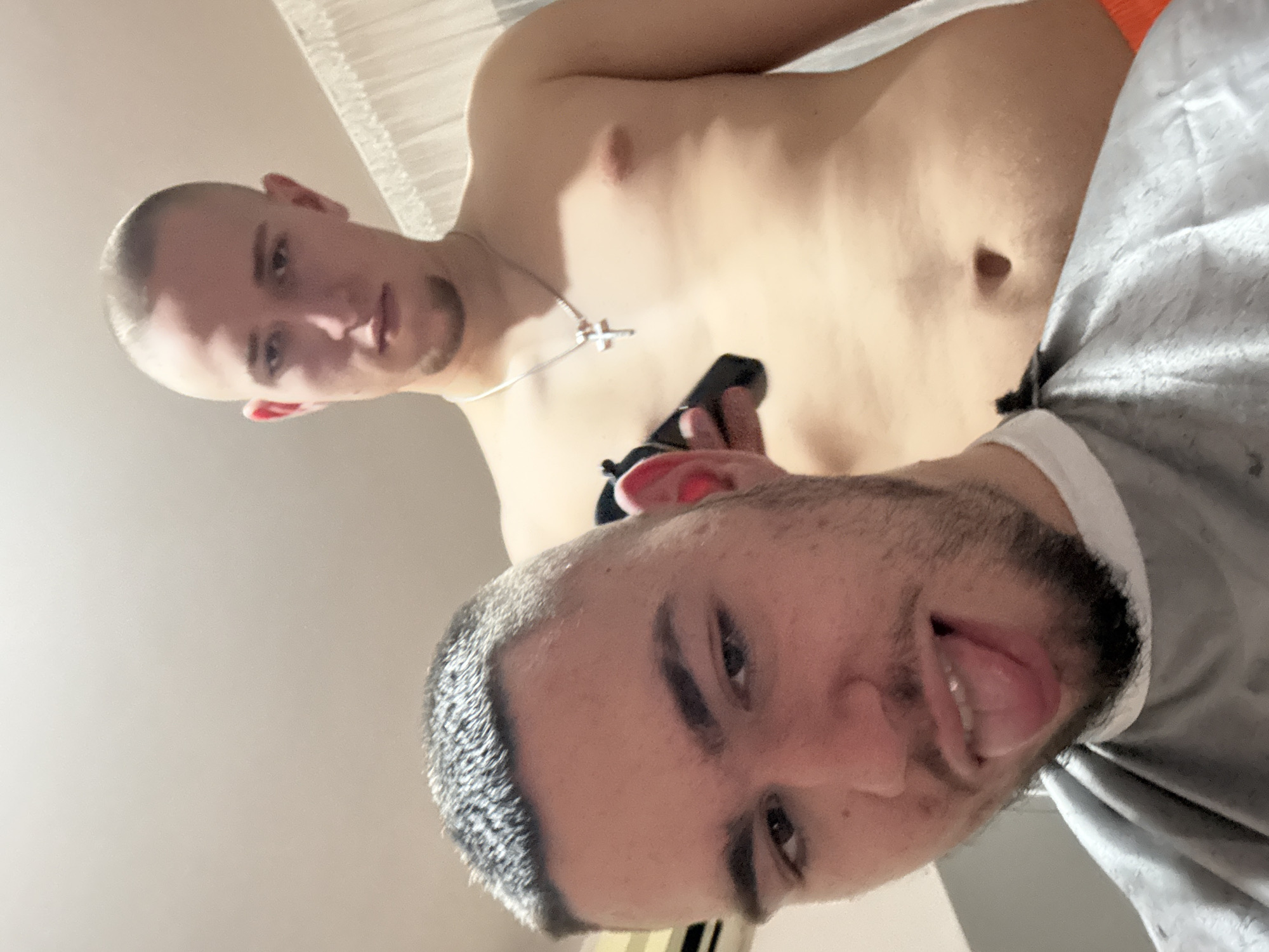Two men interact with black object in Yambol
