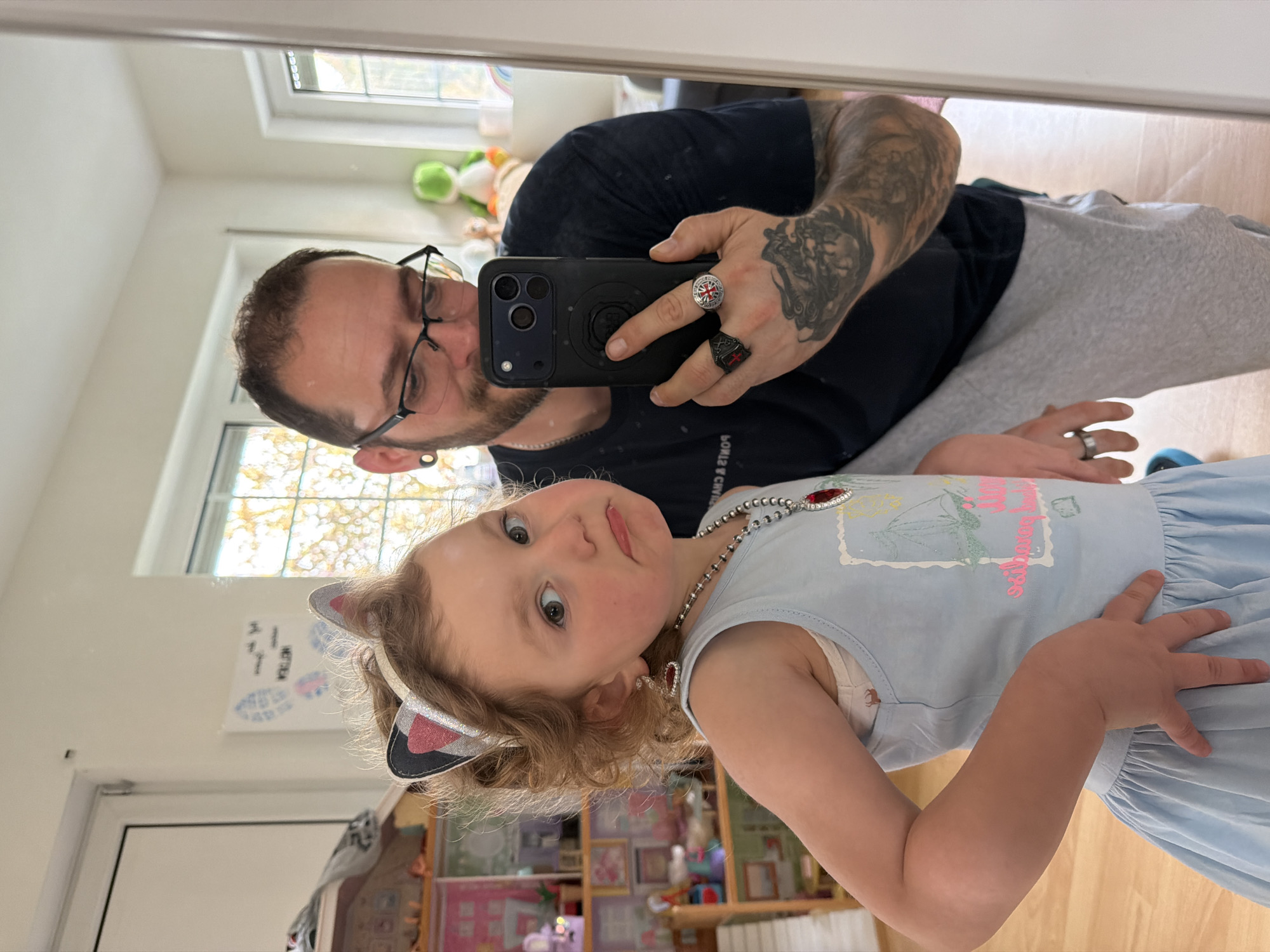Adult, child take selfie at home in Trassem