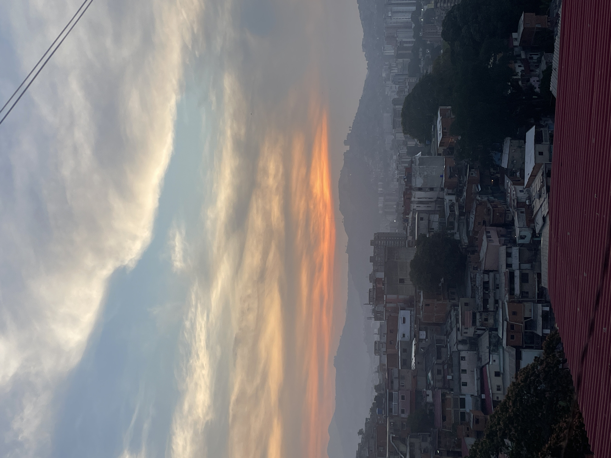 Sunset views captured across Caracas neighborhoods during evening hours