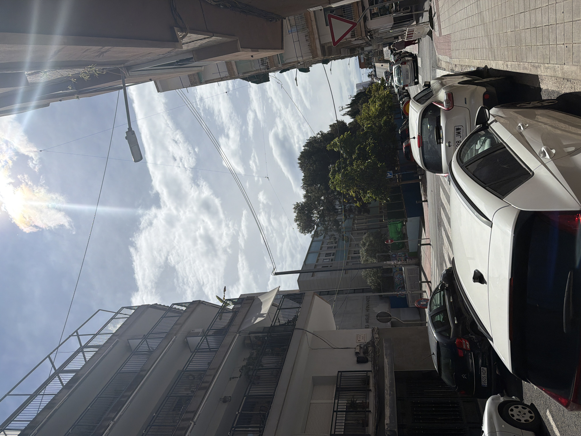 Street scene with parked cars observed in Alicante