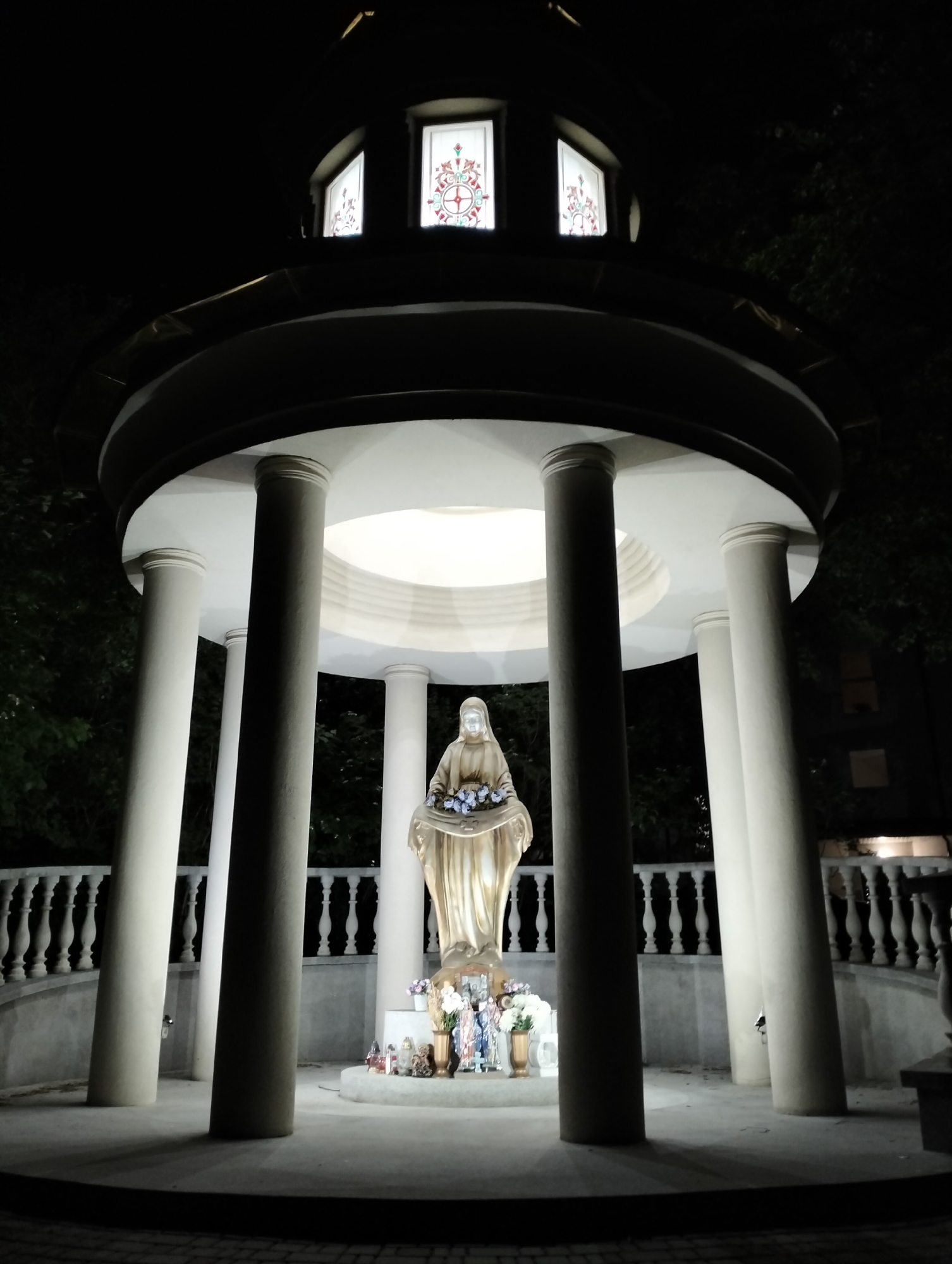Nighttime religious shrine and residential area documented in Krykhivtsi