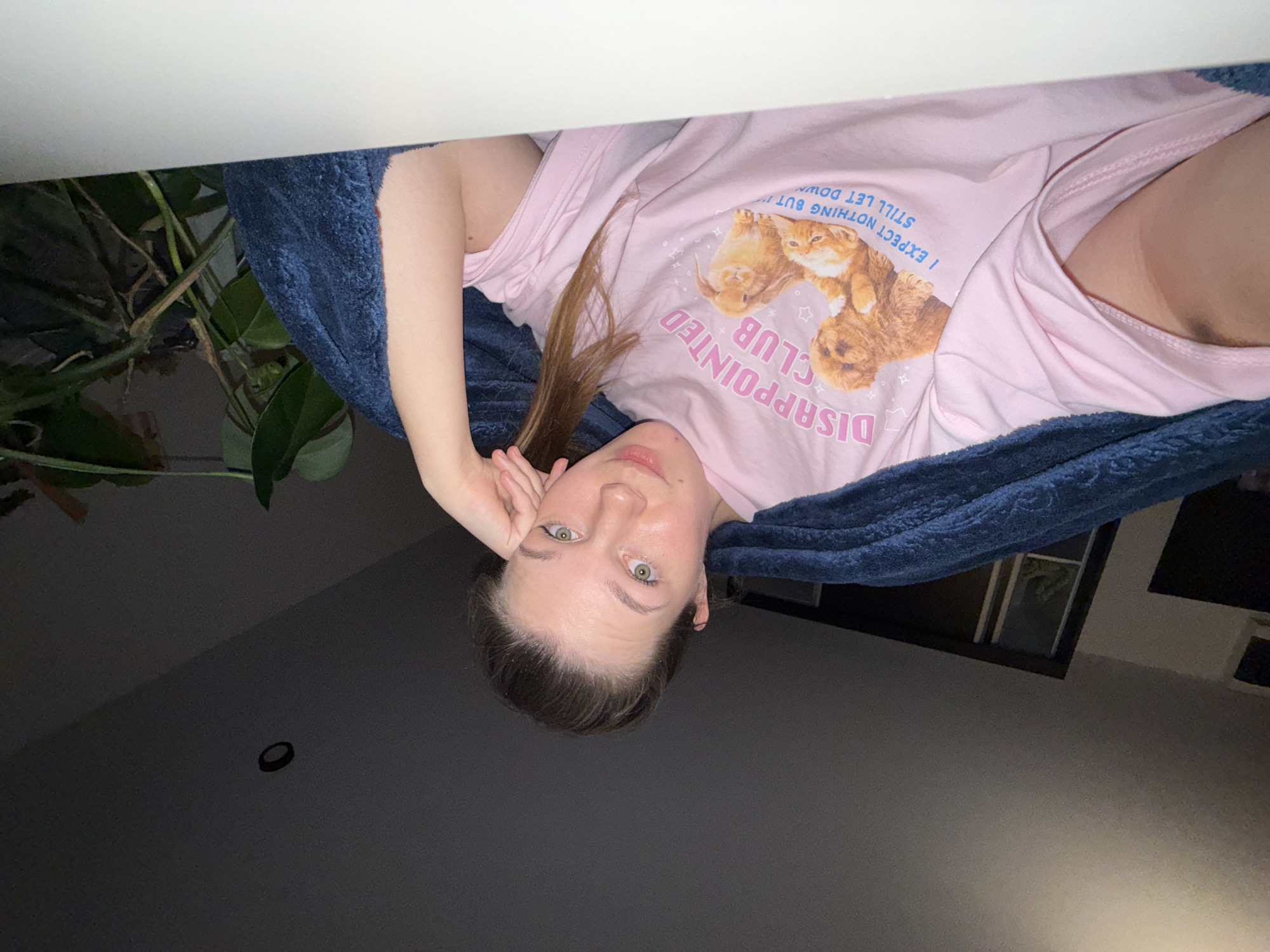 Person takes selfies in pink cat shirt in Belgrade