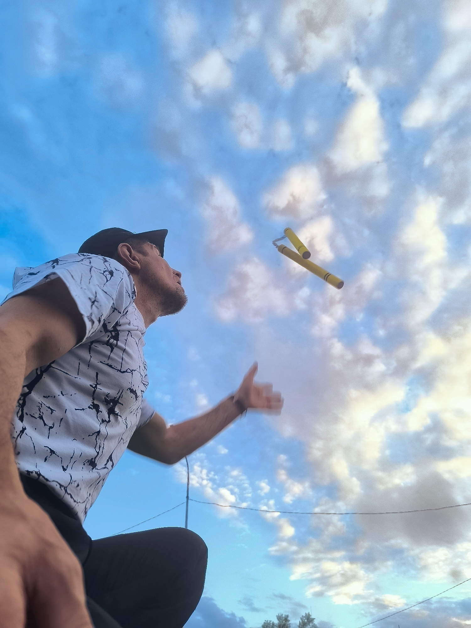 Nunchuck tricks and card games at golden hour in Karaganda