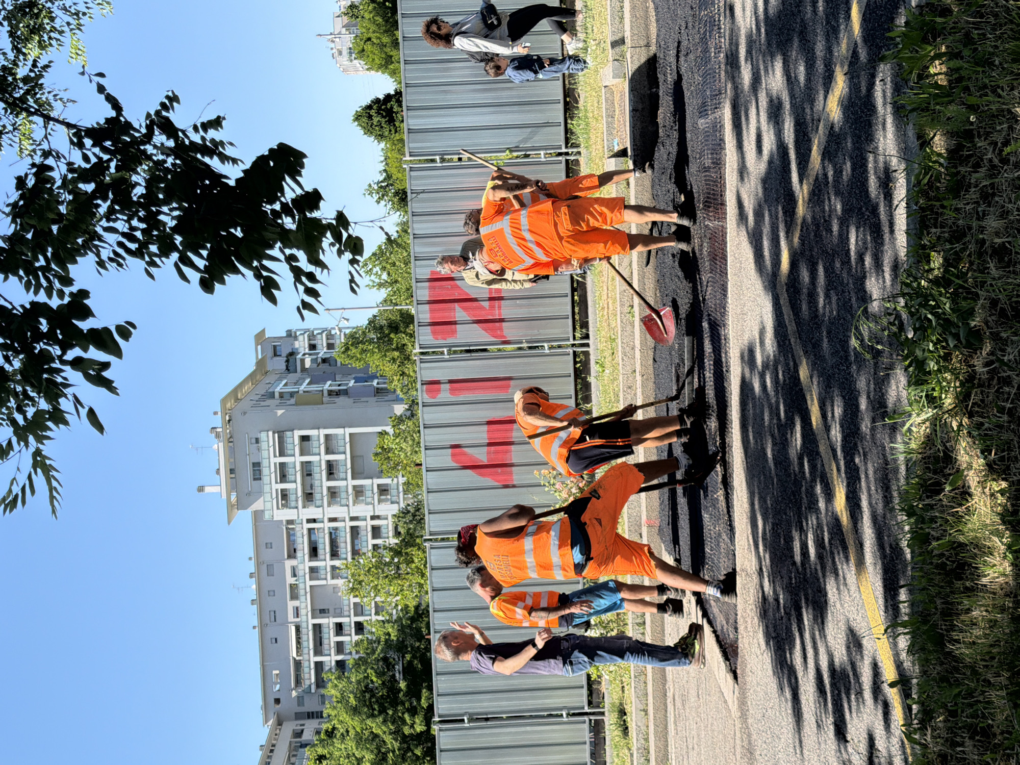 Road crews repair street in Milan