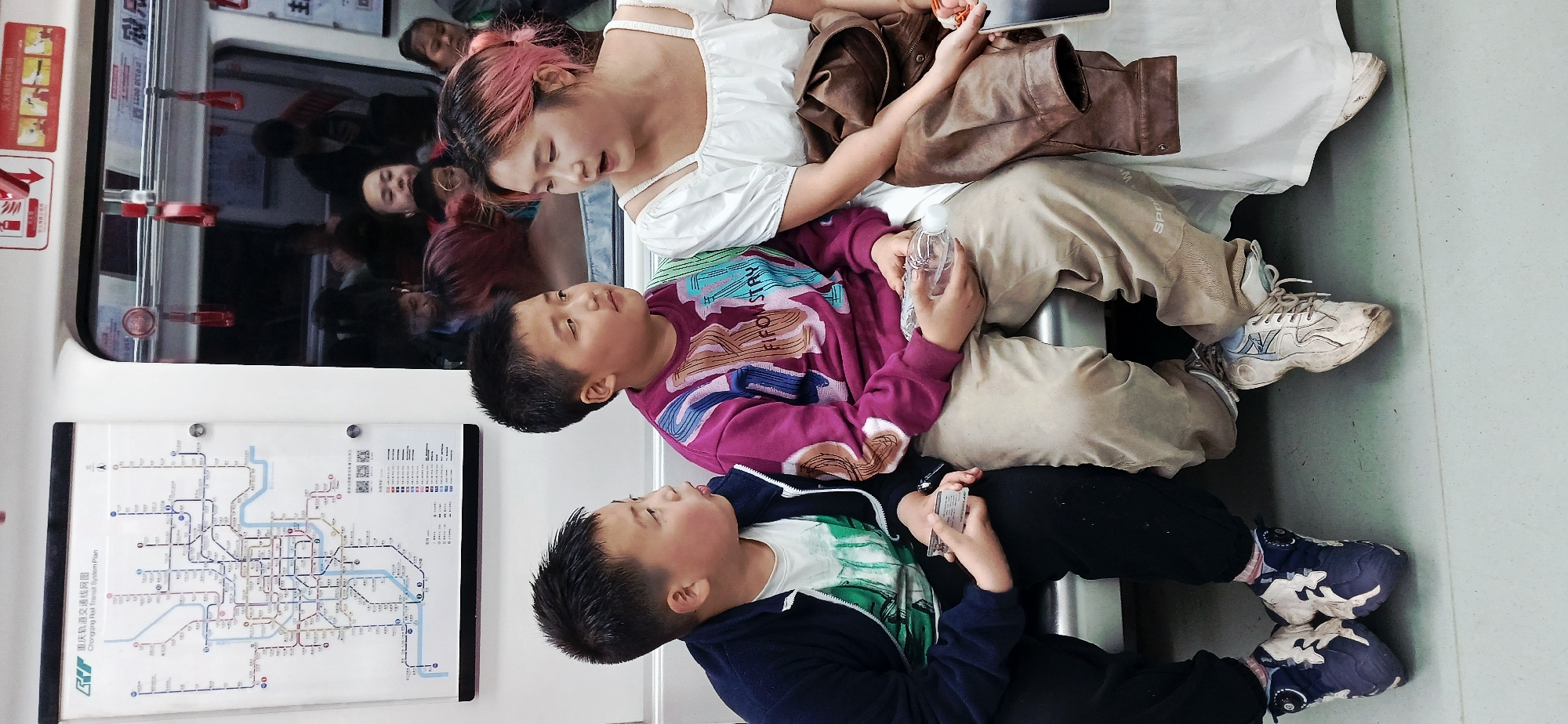 Two boys play on train car floor