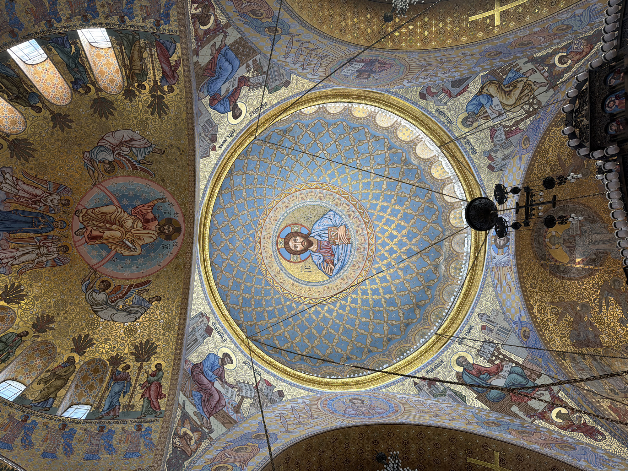 Visitor documents ornate Byzantine mosaics in Kronstadt naval cathedral