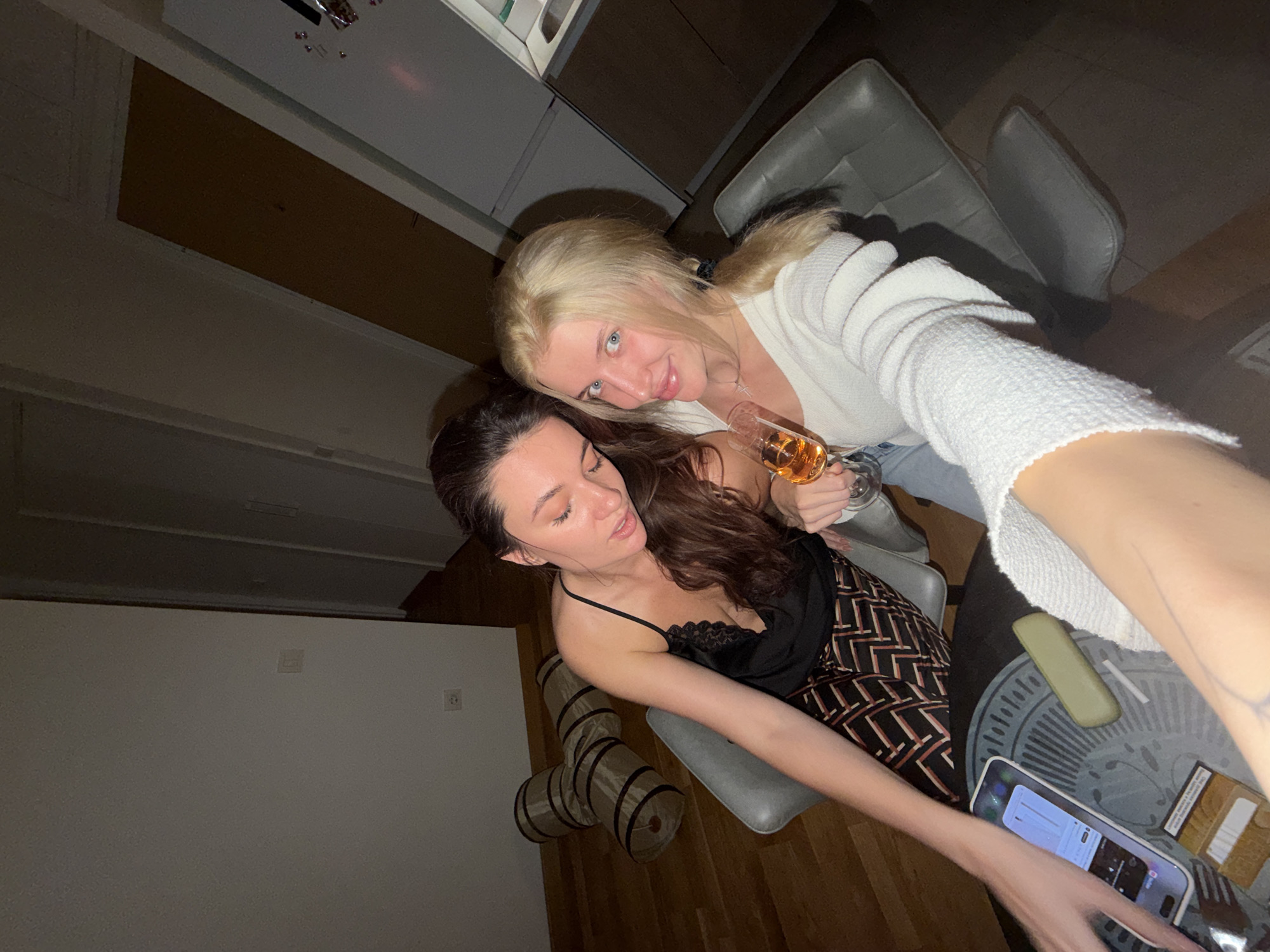 Two women celebrate with sushi and drinks in Belgrade