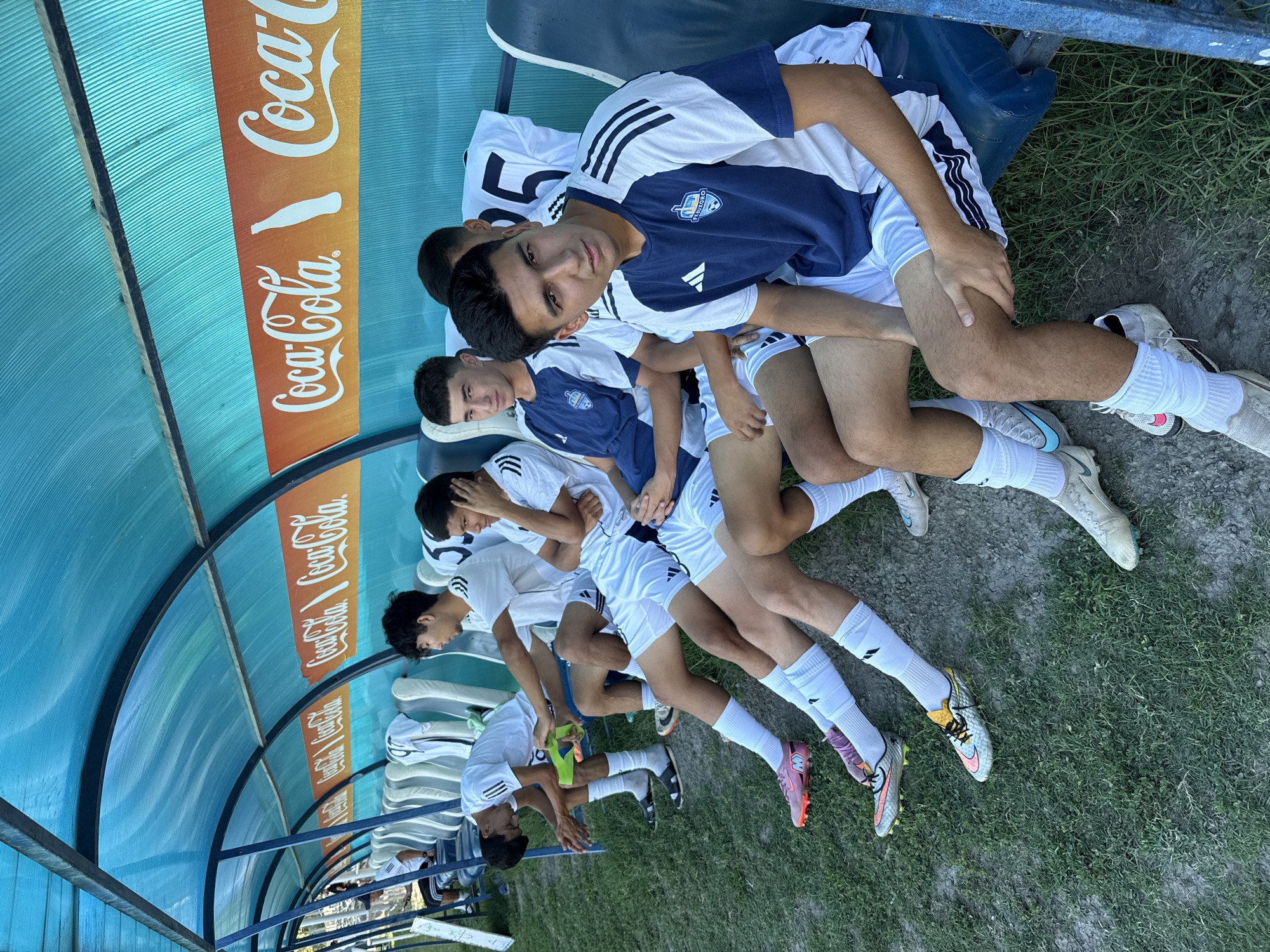 Soccer squad trains at a sunny Bukhara sports facility