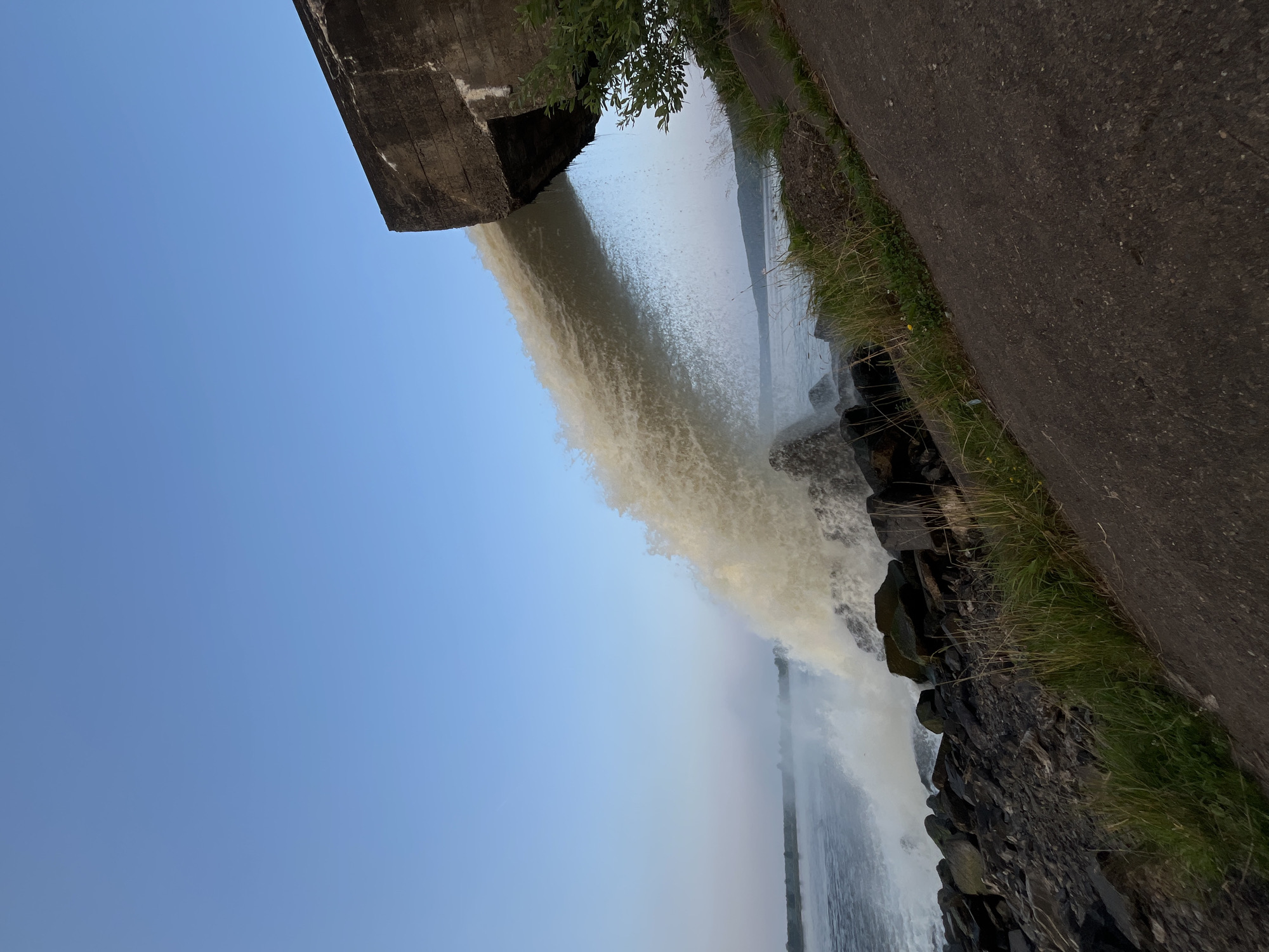 Selfies at a churning water discharge site near Chernushka at dusk