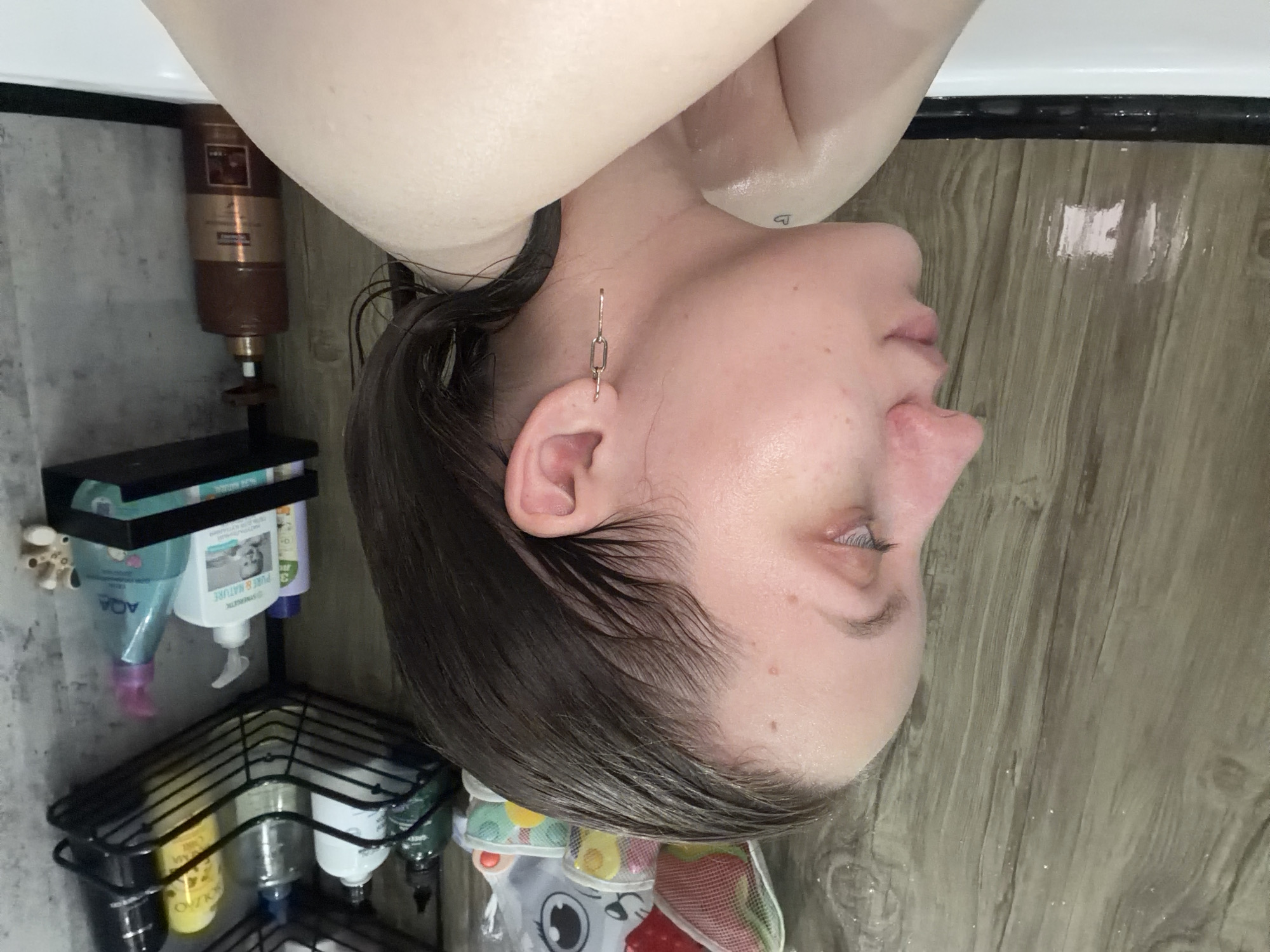 Woman bathing captured in residential bathroom, Reshetnikovo Russia