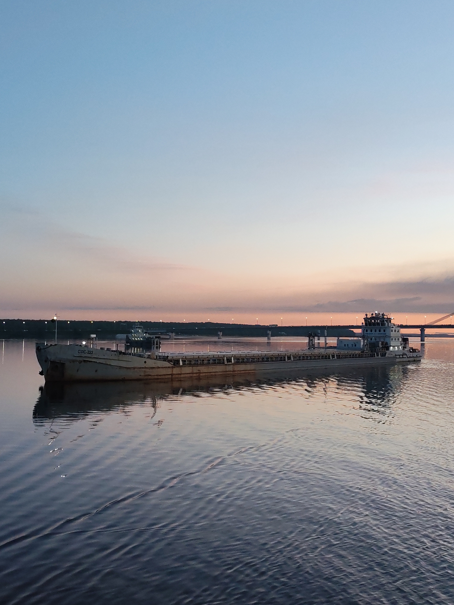 Cargo barge VOLGO-DON 161 observed at sunset near Cherepovets Bridge