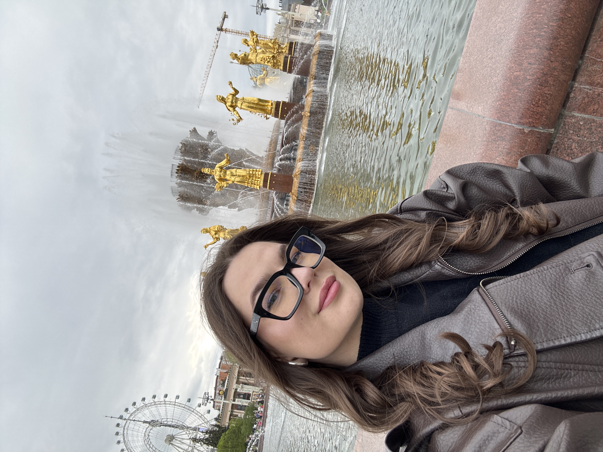 Woman takes selfies at Moscow's iconic Friendship fountain