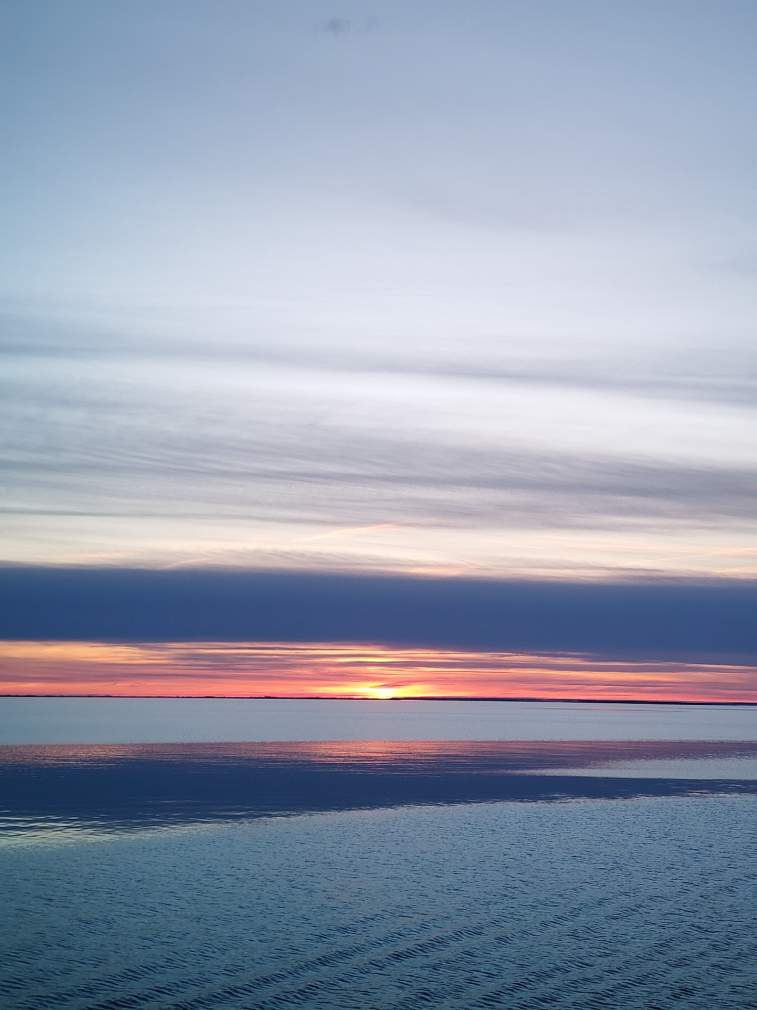 Sunset observed over water in Russia