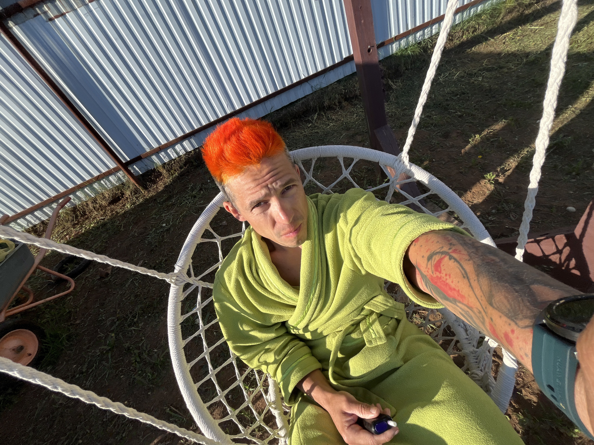 Orange-haired man photographed in casual moments in Chaikovsky, Russia