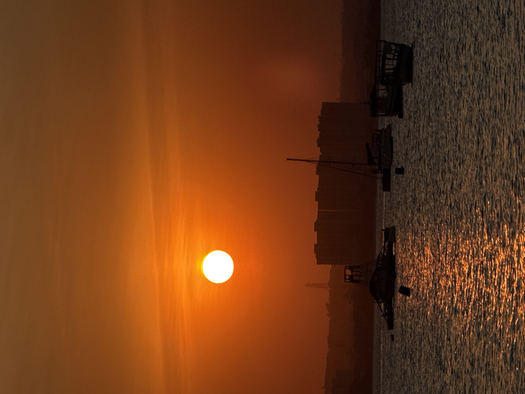 Sunset on the Dar es Salaam waterfront, boats and all.