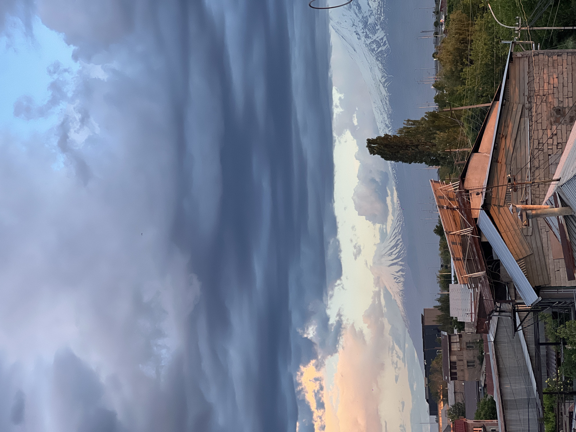 Dramatic sunset illuminates stormy skies over Yerevan, Armenia