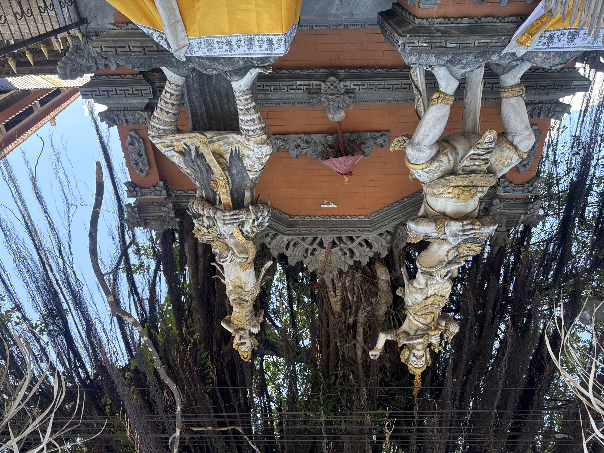 Balinese temple architecture and ceremonial decorations observed in Kubu