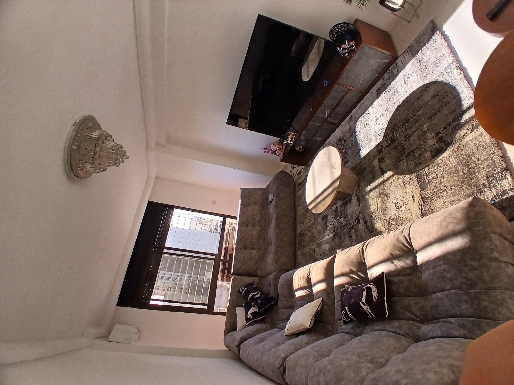 Living room with horse-themed decor and wrapped artwork documented