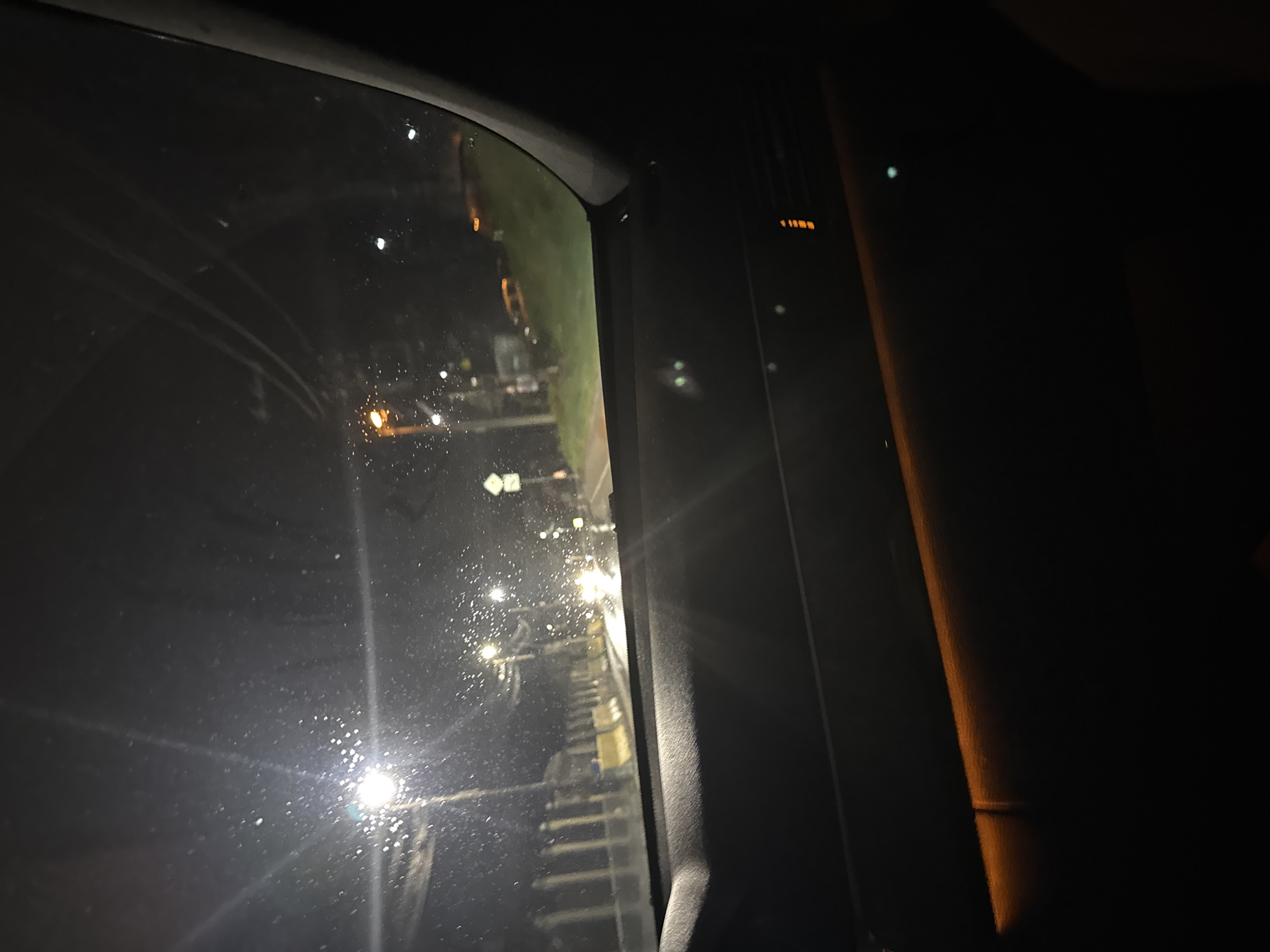 Nighttime view of pedestrian overpass from vehicle in Sofia