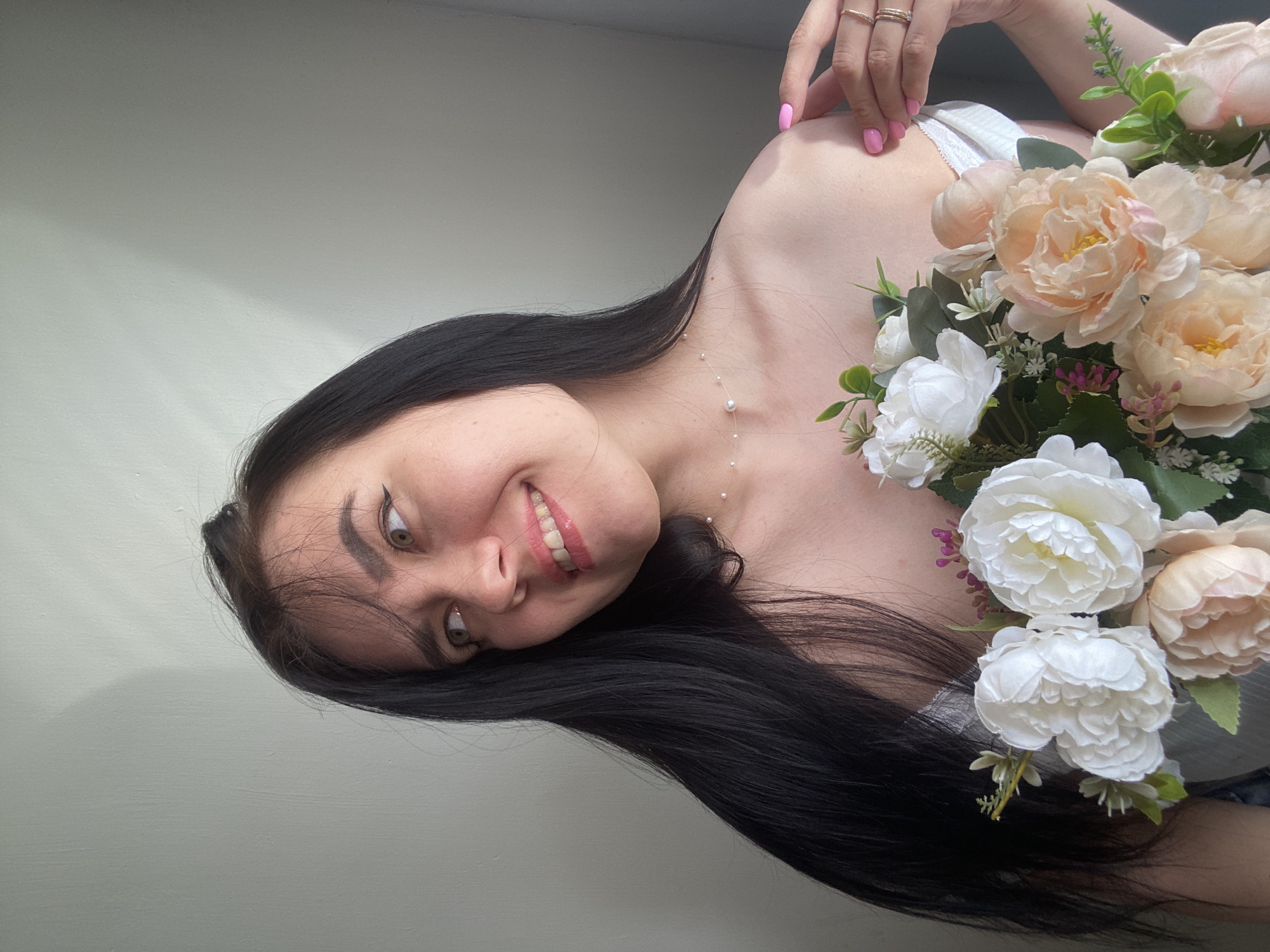 Woman poses with flower bouquet in Chaikovsky, Russia