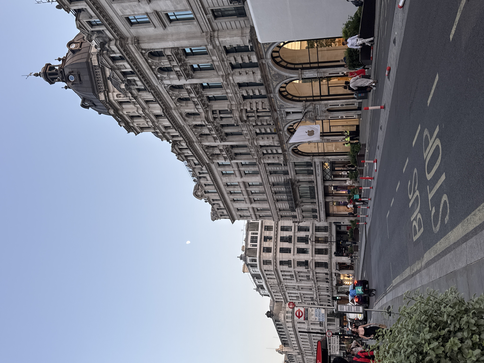 London street architecture and a gibbous moon, same evening