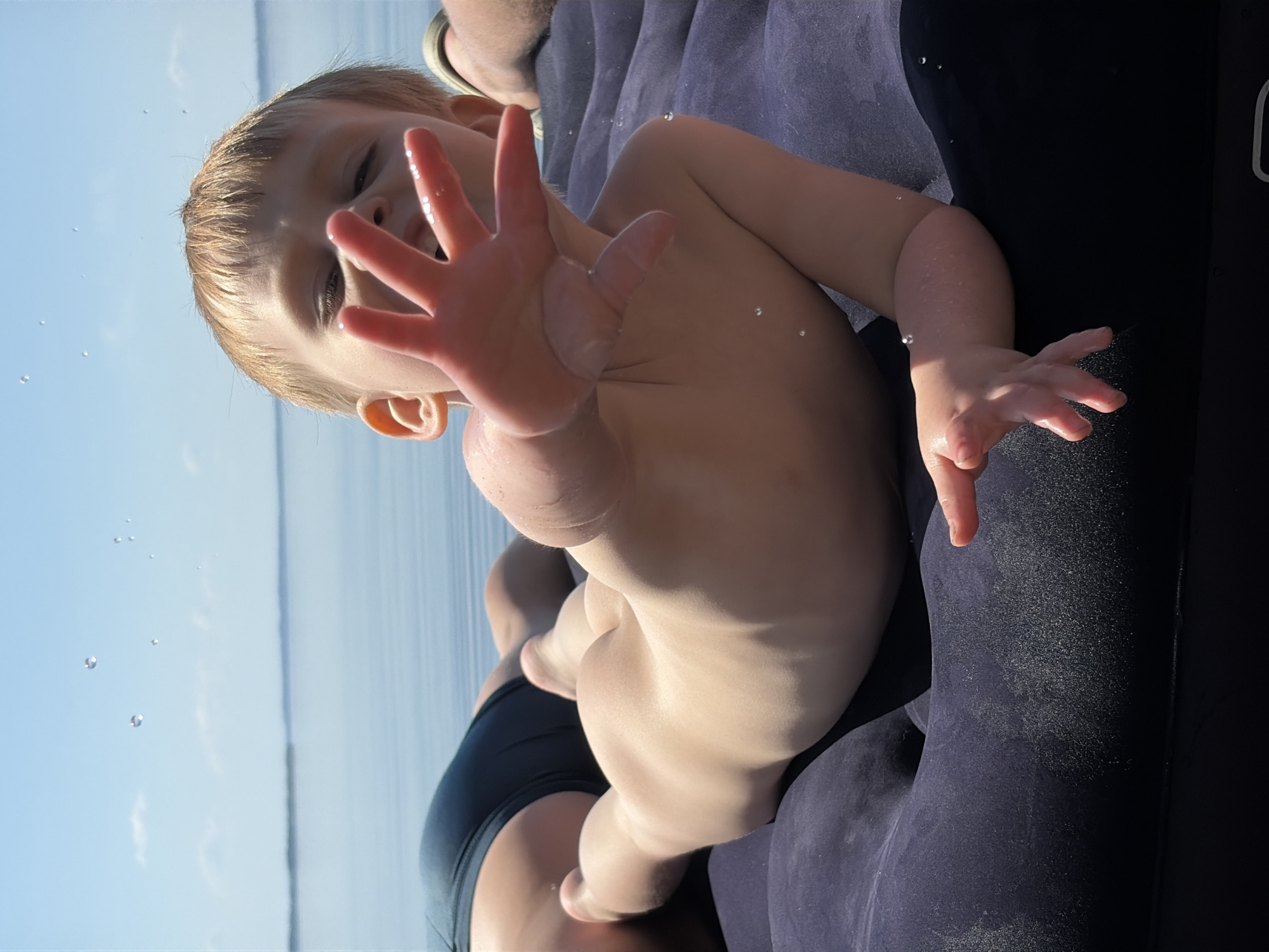 Child rests on inflatable raft in Zabegaevo waters