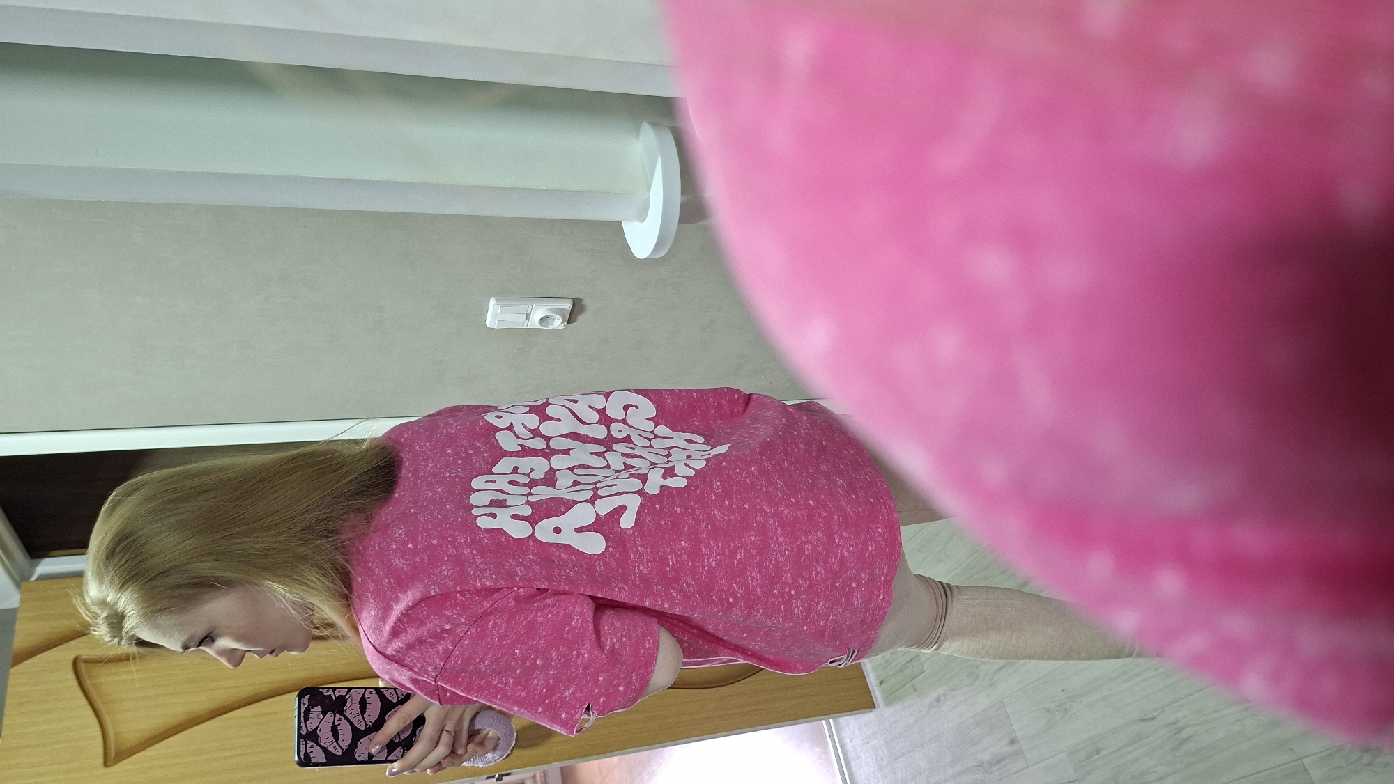 Woman takes selfies with decorated phone in Chaikovsky