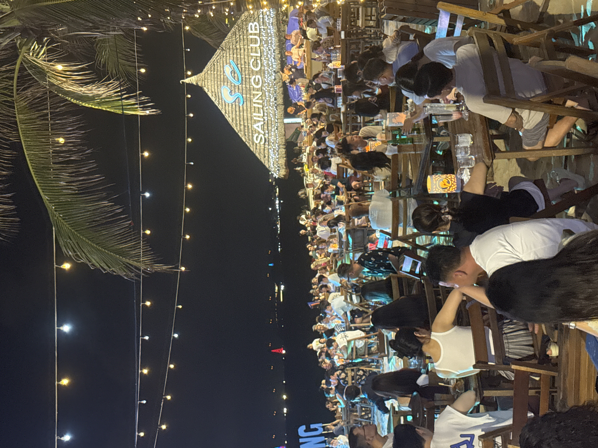 Tourist district scenes captured including beach club, markets, street music