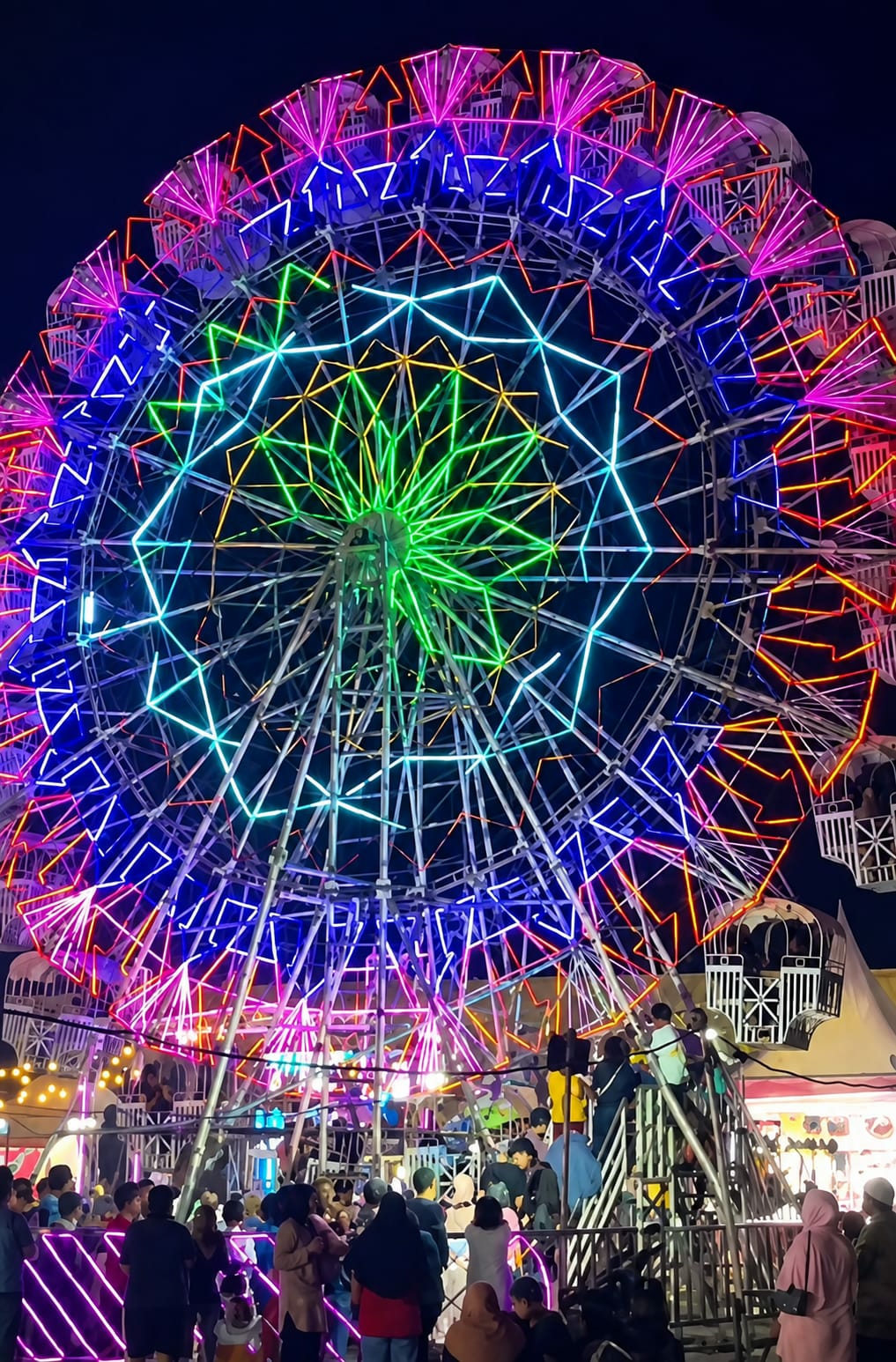 Neon-lit fairground night in Medan, Indonesia